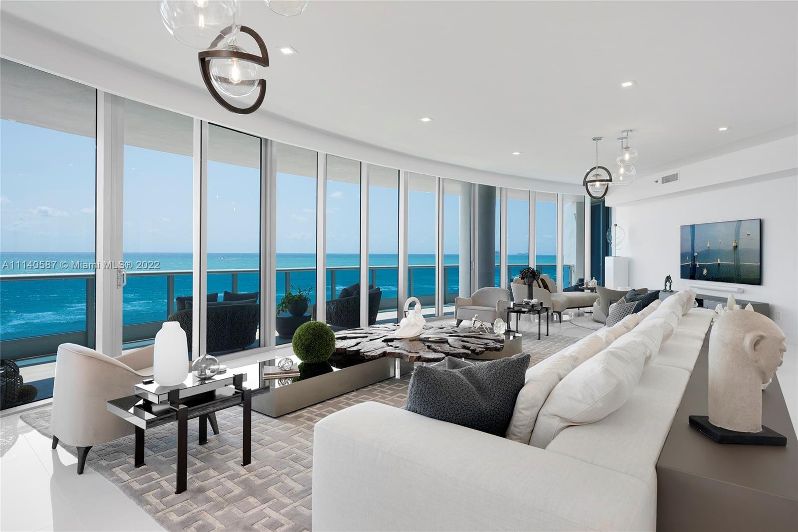 This contemporary, turnkey Oceanside unit at the exclusive Bath Club has been expertly remodeled. Sold furnished w/all electronics & includes a luxury pool-side cabana w/AC. Boasts the highest quality natural stones, woods, ceramics & linens, offering glorious ocean views in every room. State-of-the-art: high speed Wi-Fi, music system, theater flatscreens, sound bars, artisanal ceramic pendant lighting clusters. Silk rugs, Brazilian & European furnishings, including a custom designed 15‘ teak root table & 20’ couch-woven leather, linen & raw silk upholstering. Culinary space features entire walls, countertops, backsplash & waterfall dining area all w/floor to ceiling single slab marble. Amazing oceanside principal suite, Bright white walk-in closets, direct terrace access & ocean views.