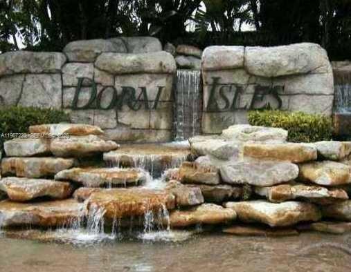 GORGEOUS TWO STORY HOME AT EXCLUSIVE DORAL ISLES St Tropez- 3BED/2/1 BATH . SPACIOUS & BRIGHT HOME FEATURES HIGH CEILINGS, CERAMIC THROUGHOUT AND WOOD FLOORS IN BEDROOMS, CUSTOM CLOSETS. OPEN KITCHEN WITH GRANITE COUNTERTOPS, STAINLESS STEEL APPLIANCES. 2 CAR GARAGE,UPGRADE KITCHEN. CLOSE TO PUBLIX, SCHOOL, TURNPIKE, AND SHOPPING PLAZA.