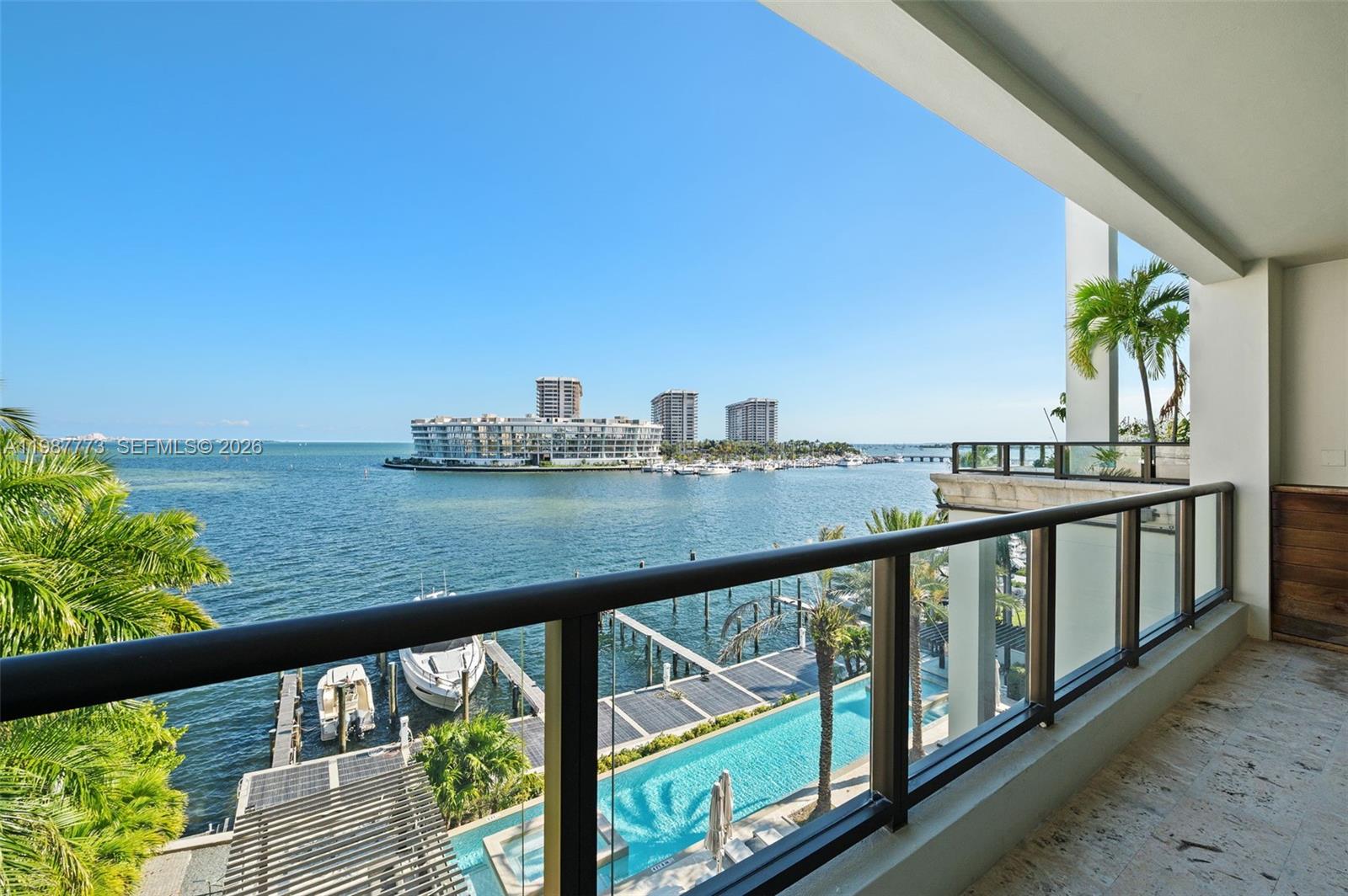 Private boutique waterfront building in the heart of Coconut Grove within the sought after Residences at Vizcaya, this unique residence offers stunning views of Biscayne Bay and is one of only 18 private units. Located on the 5th floor, this exceptional unit features 4 bedrooms and 5.5 bathrooms, with a private elevator opening to an elegant foyer that leads into a spacious open floor plan with high ceilings, ideal for both comfort and entertaining. The chef’s kitchen is equipped with premium Miele appliances and flows seamlessly into the living and dining areas. Interior finishes include marble flooring in the main living areas and wood floors in the bedrooms, along with a family room, laundry room, an expansive terrace with a built-in summer kitchen overlooking the water, and an additional balcony in the back with views of the lush park. The residence also offers four covered parking spaces and a storage unit. Building amenities include a fitness center, 24-hour concierge, private marina, community lap pool, and two spas, plus a small park just downstairs, ideal for pet lovers. Ideally located near top-rated schools, shopping, dining, and parks, and just minutes from Downtown Miami and Key Biscayne.