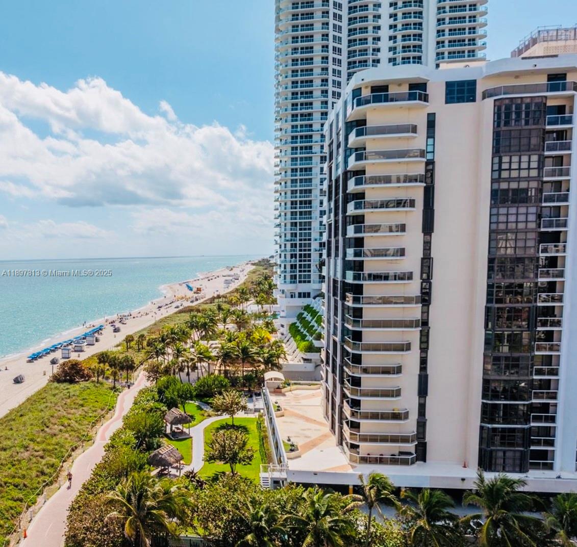 Investor Special! Bright and spacious 1,955+ sq. ft. corner unit with 2 bedrooms, 2 bathrooms, panoramic ocean views, open kitchen with island, and large bedrooms with balcony access. Private beach access and building amenities include pool, sauna, clubhouse, gym, business center, 24/7 security & doorman, BBQ area, covered parking, valet, and guest parking.

Prime location close to South Beach, I-195/112, Miami International Airport, hospitals, restaurants, and Bal Harbour Shops. Maintenance includes cable, internet, and A/C—occupant only pays for electricity. Vacant and easy to show, needs remodel—perfect for the right owner to make it their own. Building will replace all impact windows. 4-month minimum rentals allowed.