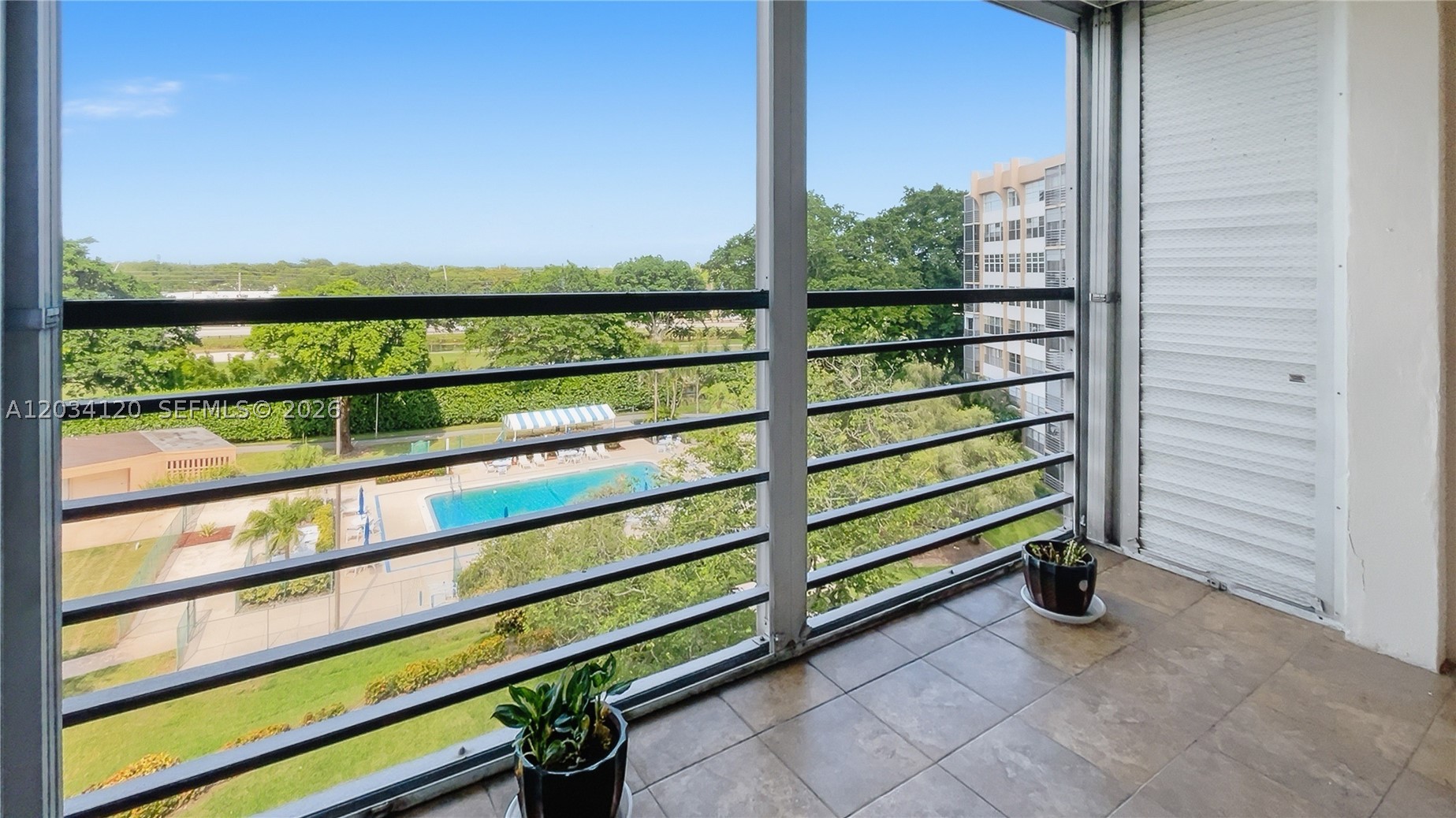 Great opportunity to own! Serene retreat located on Vibrant Park Place 55+ condo community at The Banyan. Freshly painted, 1/1.5 condo shows beautifully, featuring a screened balcony with beautiful views of the pool, a newer A/C unit, and modern laminate flooring in the bedroom.  Amenities: 4 Pools, tennis Courts, picnic areas, bike storage, exercise rm., clubhouse, laundry facilities, and courtesy bus. Don't let this one go away!