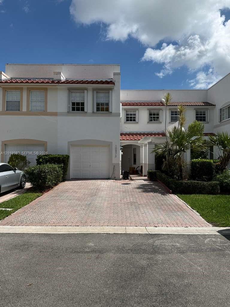 Welcome to this gorgeous two-story residence located in the exclusive Antigua section of Doral Isles. This bright and spacious 3-bedroom, 2.5-bath home offers an elegant blend of comfort and modern upgrades throughout.
**PROPERTY HIGHLIGHTS:NEW ROOF 2024, UPGRADED KITCHEN & BATHROOMS, CUL-DE-SAC LOT, FULLY FINISHED & MOVE-IN READY**
The first floor features sleek porcelain tile, while bedrooms offer warm wood flooring. Includes custom closets and beautifully upgraded bathrooms. The fully renovated kitchen is designed to impress, showcasing quartz countertops, upgraded cabinetry, and newer appliances. The garage has been thoughtfully converted into a versatile space, perfect for a home office, playroom, or guest room. 
Additional features include roller shades throughout and accordion hurricane shutters on the second floor.Situated on a quiet cul-de-sac, the home offers ample guest parking right across the house. Its prime location places you right in the heart of Doral Isles, directly in front of the community’s premier amenities—including the clubhouse, resort-style pool, fitness center, soccer field, and tennis courts—offering unmatched convenience. There is even an onsite full-service restaurant poolside. Community offers high-end 24-hour security and high-speed internet provided by the association. This home is in excellent condition and represents a rare opportunity to own in one of the most prestigious communities in Doral.