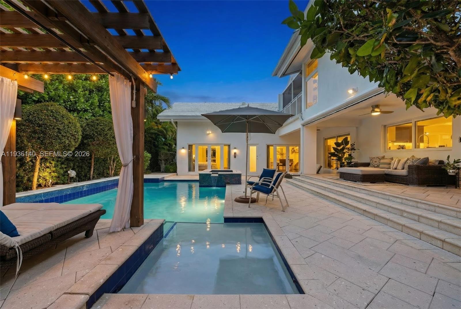 New finishes. New price. Exclusive Bay Harbor Islands address - meet the single family MUST HAVE buy of 2026! 
Located in the heart of Bay Harbor Islands, one of Miami’s most sought-after neighborhoods, this stunning mid-century modern residence offers 5 bedrooms, 5.5 bathrooms, and over 5,000 square feet of thoughtfully designed living space, set on a 10,000-square-foot lot. Rebuilt in 2009, the home seamlessly blends timeless architecture with modern luxury finishes. Featuring expansive ensuite bedrooms, a private office, den, and loft, the home is filled with natural light, soaring ceilings, rich wood and stone accents, and impact windows throughout. The chef’s kitchen is equipped with top-of-the-line Miele and Sub-Zero appliances, perfect for both everyday living and entertaining. The primary suite is a true retreat with multiple closets, a spa-inspired bathroom with a multi-jetted shower, and a private balcony. Outdoors, enjoy a resort-style backyard complete with a custom heated pool and jacuzzi, sun shelf, summer kitchen, pergola, pool bath, and lush tropical landscaping, including a butterfly garden.
Ideally located just moments from the beach, Bal Harbour Shops, cafés, parks, tennis courts, and A-rated schools. No HOA. A rare opportunity to own a refined, move-in-ready home in an unbeatable location. Visit us at 1251 96th Street Bay Harbor Islands to see effortless luxury living at its finest.