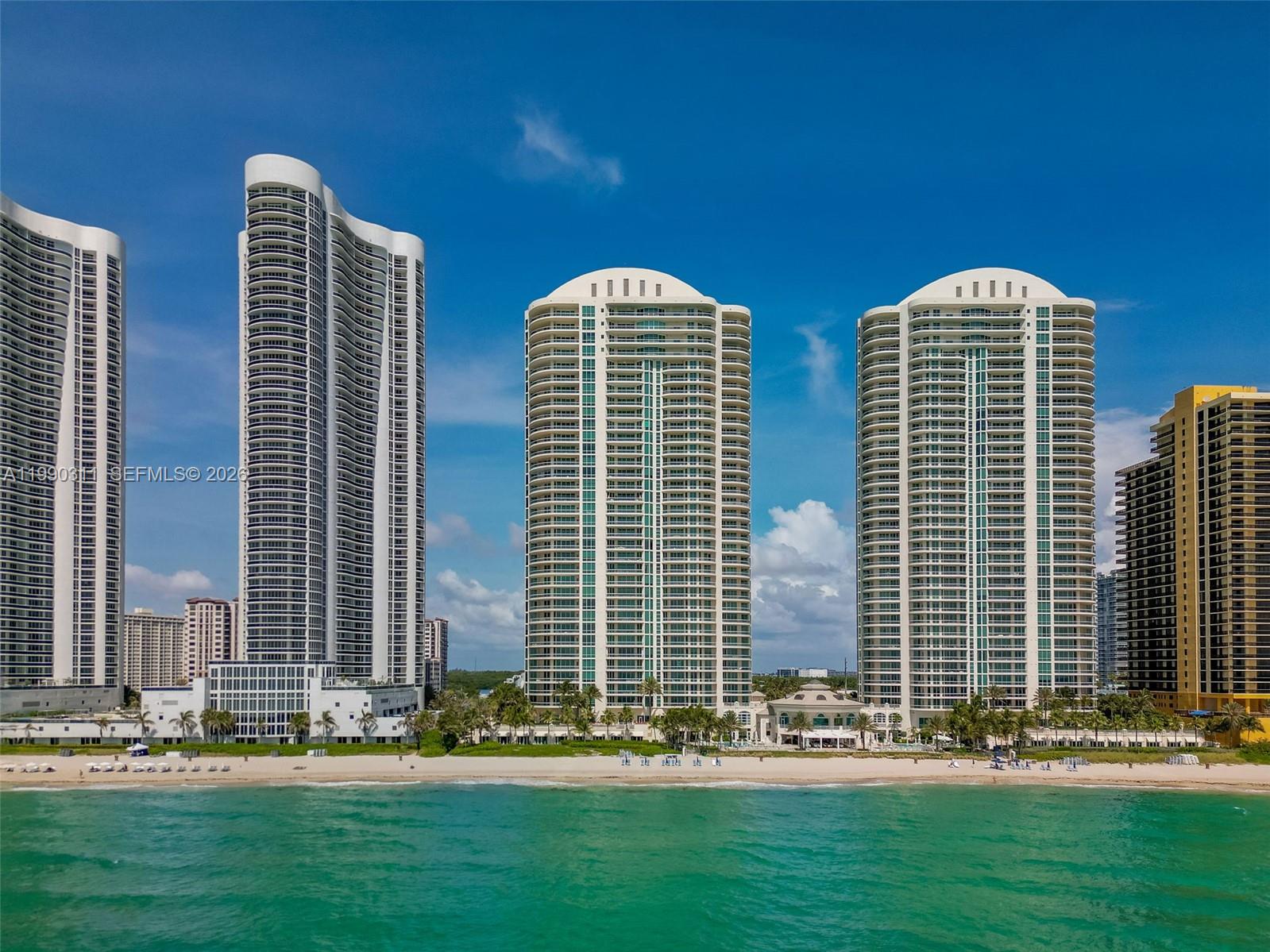 Experience exceptional oceanfront living at the renowned Turnberry Ocean Colony in Sunny Isles Beach. Situated on the 16th floor, this elegant 3-bedroom, 4.5-bathroom residence offers 3,735 square feet of beautifully designed living space and is fully furnished and move-in ready, providing an effortless transition into luxury coastal living.
A private elevator entry opens into a sophisticated foyer leading to expansive living and dining areas filled with natural light. The residence features a desirable flow-through floor plan, showcasing breathtaking direct ocean views from the main living areas and picturesque intracoastal and sunset views from the secondary bedrooms. Floor-to-ceiling windows, high ceilings, and a spacious oceanfront terrace create a seamless indoor-outdoor setting perfect for relaxing or entertaining.
The gourmet kitchen is thoughtfully designed with premium appliances, ample cabinetry, and a comfortable breakfast area overlooking the water. The luxurious primary suite serves as a private retreat, complete with a spa-inspired marble bathroom, soaking tub, dual vanities, and a generous custom walk-in closet.
Residents of Turnberry Ocean Colony enjoy access to five-star amenities, including private beach service, an oceanfront pool, exclusive dining options, a state-of-the-art fitness center, full-service spa, concierge services, valet, and 24-hour security. 2 private parking spaces, storage. Private 2 car Garage for sale $250,000.