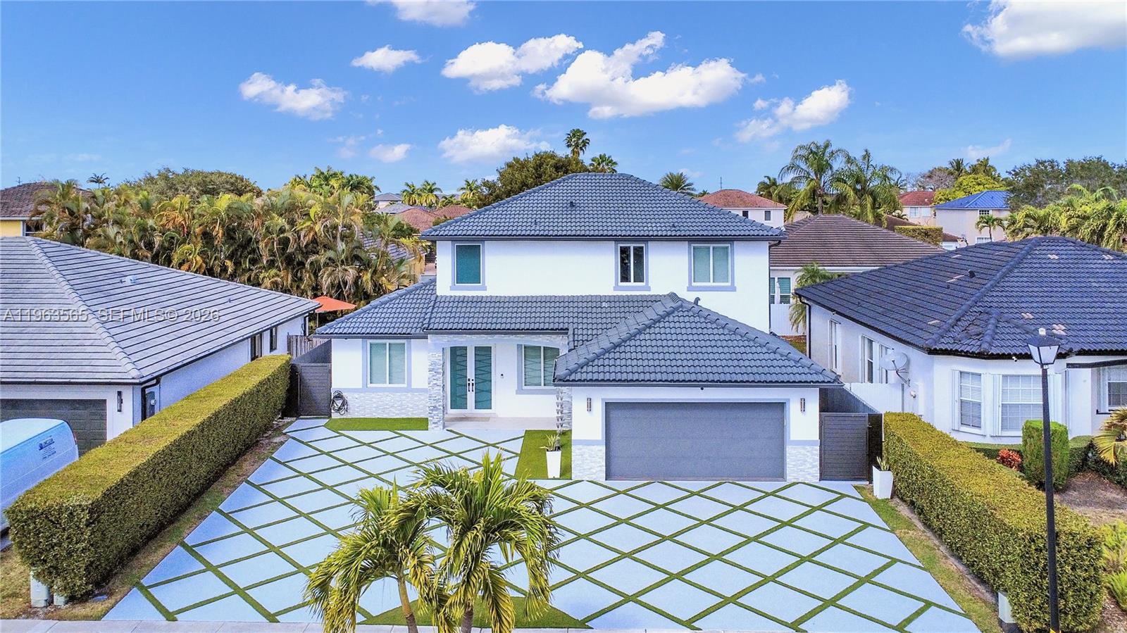 An exceptionally refined, fully remodeled residence offering timeless design, privacy, and elevated living in a sought-after Kendall enclave, free of association restrictions.
Thoughtfully reimagined with quality and intention, the interior showcases expansive,light-filled living spaces finished with elegant Spanish porcelain flooring and a refined, cohesive design throughout. A custom, floor-to-ceiling glass-enclosed wine wall serves as a dramatic architectural focal point, created to display and preserve an impressive wine collection while enhancing the home's entertaining appeal. The chef-inspired Kitchen features sleek contemporary cabinetry, premium appliances, refined finishes, and a generous waterfall island, creating a seamless environment for both daily living and sophisticated gatherings. Impact windows and doors provide security, energy efficiency, and peace of mind. A full bedroom and bathroom on the main level offer flexibility for guests, a home office, or multigeneration living. The covered entertainment area features a designer outdoor kitchen with a built-in barbecue grill and natural stone countertops. 
Completely remodeled and impeccably maintained, this move-in-ready residence delivers style, comfort, and lasting value.