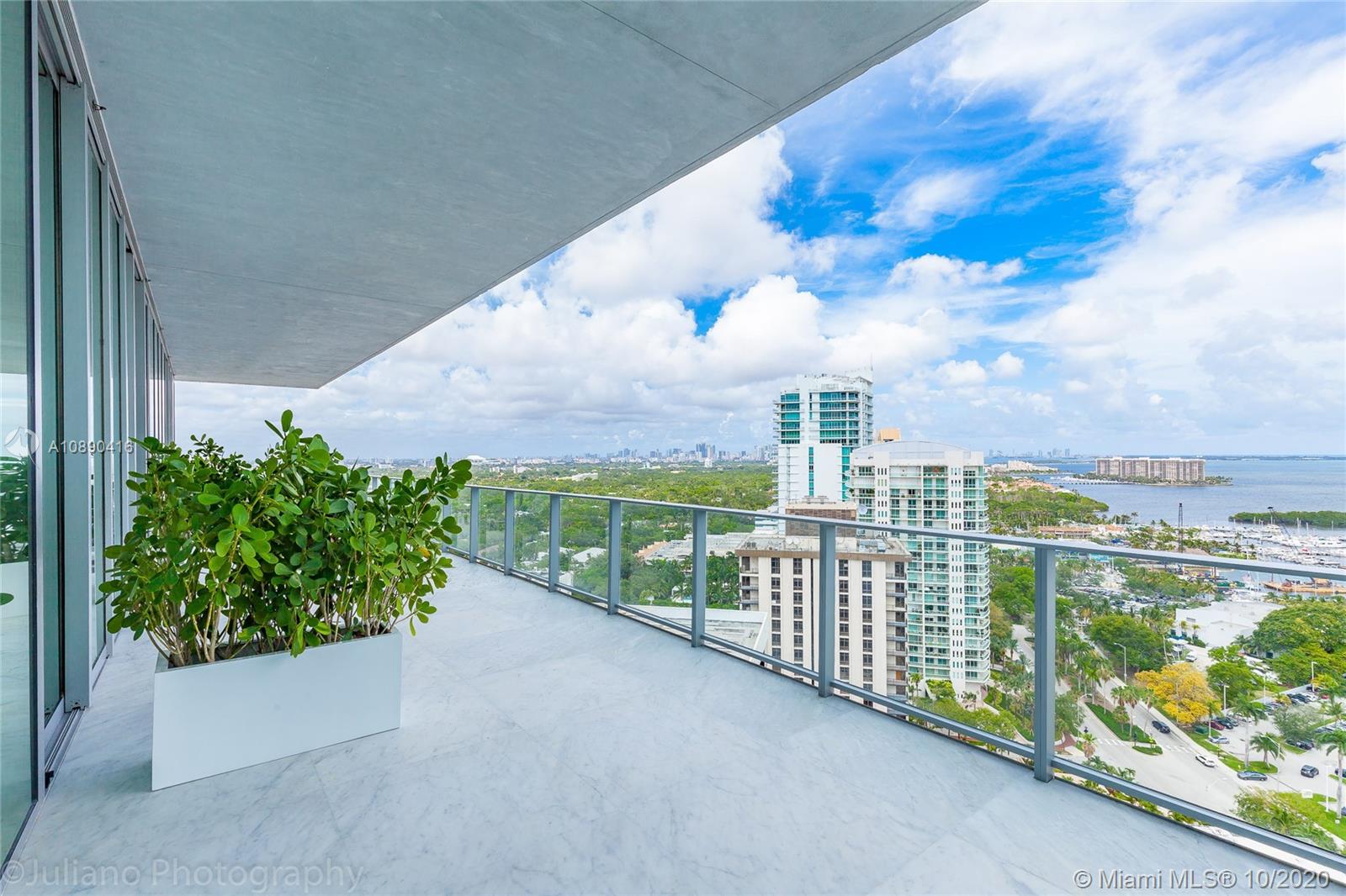 Grove at Grand Bay is an architectural masterpiece.  PH1902N is a Stunning 19th floor, 5213 SF residence.  This 5 BR, 6/1 BTH residence has a 12 FT high ceilings & 12 FT deep terraces offering 180 degree views of Coconut Grove and Biscayne Bay. Beautifully finished with marble floors throughout, wood paneling, marble master bath and Miele appliances. Fully furnished.  Three parking spaces!  Residence offers over 60 FT of frontage.  Amenities include 2 swimming pools, spa, fitness center, children's playground and pet spa. A must see.