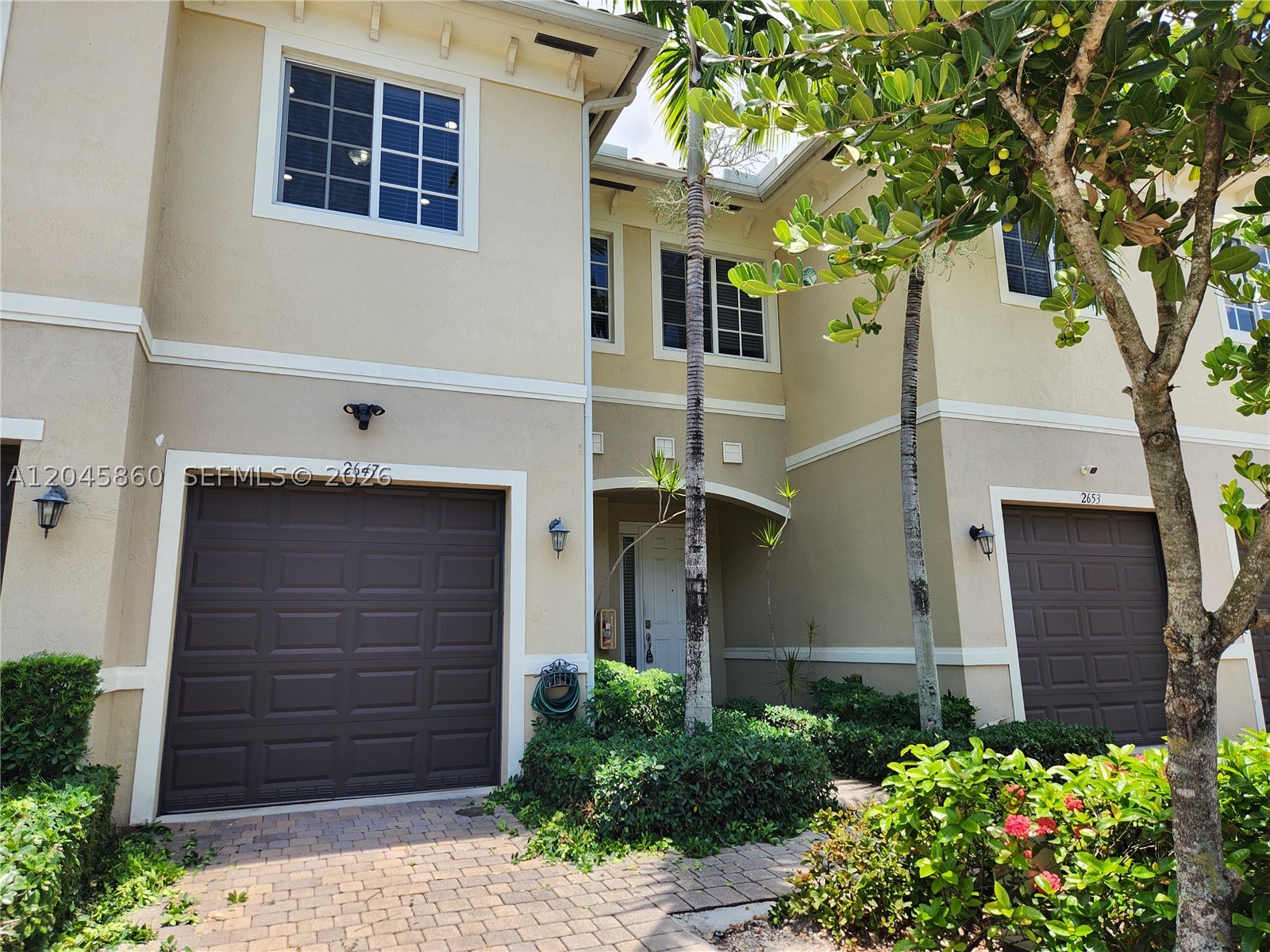Beautifully maintained 2-bedroom, 2.5-bath townhouse located in the desirable Calabria II Residences. Built in 2017, this move-in-ready home features porcelain tile flooring on the first floor and carpet upstairs, hurricane-impact windows, and a one-car garage. The modern kitchen offers custom European-style cabinetry, granite countertops, and Kenmore Design Series stainless steel appliances. A full-size washer and dryer are included. Both bedrooms feature en-suite bathrooms with granite countertops, and one includes a glass-enclosed shower. Enjoy relaxing lake views from your home, along with access to the community pool, ample guest parking, and low condo fees. Conveniently located near shopping, dining, schools, and major highways. A must-see!