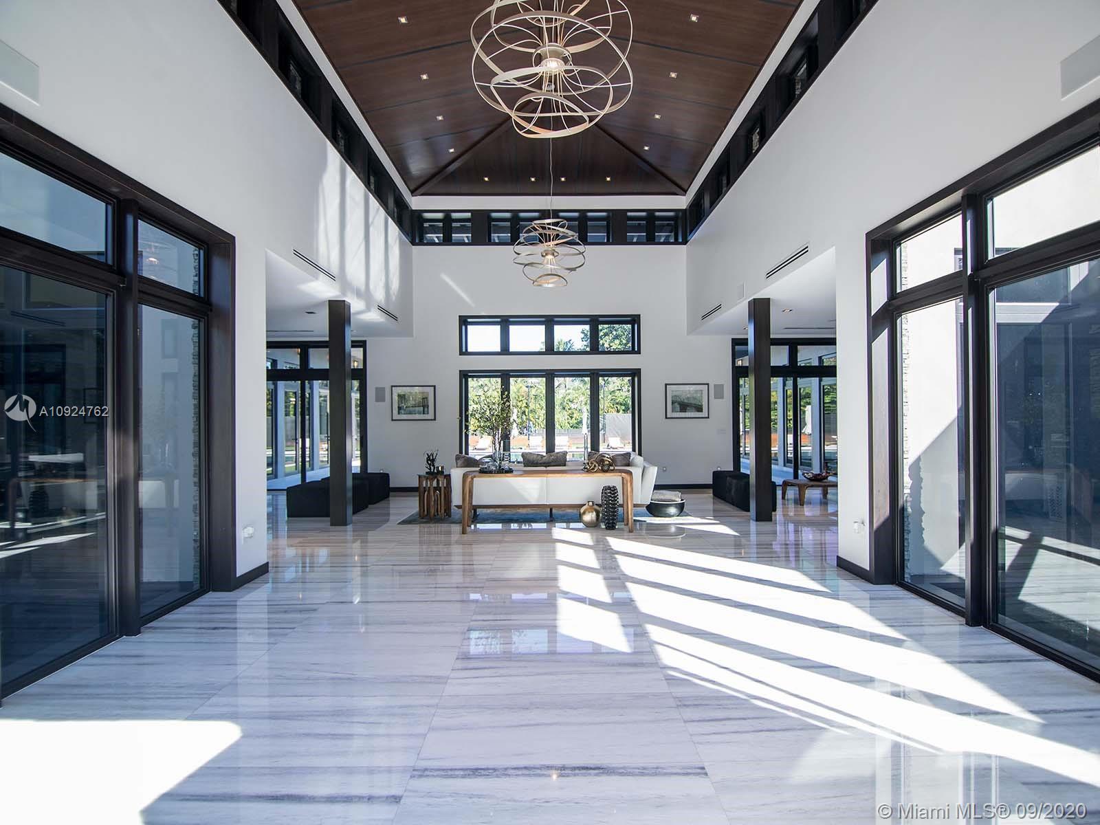The pinnacle of tropical luxury is this 11,300 sf custom home on 1.16 acres in Prime North Pinecrest. Bali-resortstyle property includes 2 masters, 5 addtl bedrooms, office, full gym, massage area, 11 baths, guest house,
saltwater pool, pong, whirlpool, lighted European red-day tennis court, and 2 sundecks. Cabana with summer
kitche, pizza oven, and hibachi frill offers amazing entertaining. Inside kitchen feautures Wold, Sub-Zero, and
Bosch, dual ovens and dishwashers and enormous marble island. Gray marble floors, wenge wood ceilings, Bizzaza
mosaics, Duravit fixtures, Swavorski Chandeliers, ELAN smart home system, Pentair water filters, and geothermal
heating,
