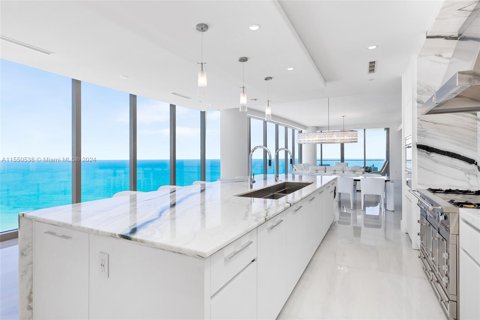 Welcome to this 44th Floor 4-bedroom 5.5-balth flow-through residence with spectacular sunrise and sunset views in the ultra-luxurious and highly sought-after Estates at Acqualina. A 14-foot long island, a gas La Cornue range, a pizza oven, and a steam oven grace the kitchen. Elegant touches like Onyx stone throughout the master bath and marble floors in every room of the home. The back terrace comes with an outdoor kitchen and sauna. Experience 5-star resort-like amenities, including pools, spa and fitness center, restaurant, and more. Fully furnished by Luxury Living: Fendi & Bentley furniture & rugs.