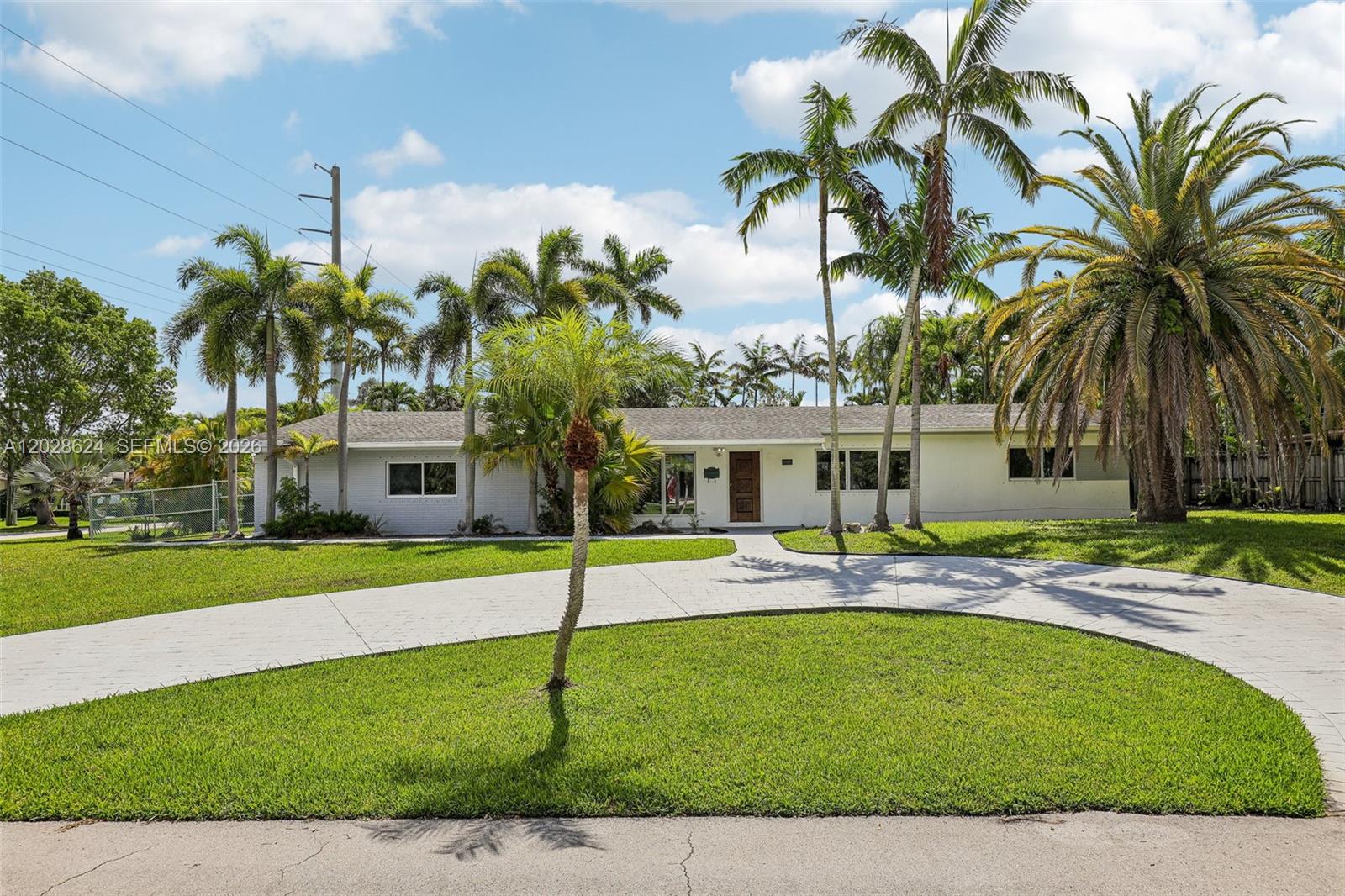 Exceptional opportunity to own a private tropical retreat on a spacious corner lot in a highly desirable Miami location. Surrounded by mature palms and lush landscaping, this property offers a rare combination of privacy, space, and potential. The circular driveway creates outstanding curb appeal while providing ample parking.Inside, the home features bright living spaces, abundant natural light, large windows, and a functional floor plan ready for your personal touches. Generous room sizes provide flexibility for families, guests, a home office, or additional living areas.The backyard is the centerpiece of the property, featuring a large swimming pool, expansive patio areas, and a beautifully landscaped setting ideal for entertaining or relaxing year-round. The oversized yard offers plenty of room for outdoor activities, gardening, and future improvements. Mature tropical landscaping creates a peaceful and private atmosphere rarely found in such a central location.The spacious primary bathroom features quality finishes, a large walk-in shower, and a spa-inspired feel. Conveniently located near major highways, shopping, dining, parks, and schools, this property combines everyday convenience with the feeling of a private retreat. Whether you’re looking for a primary residence or an investment opportunity, this home offers tremendous potential in an excellent location. Rarely do properties with this much land, privacy, and outdoor living space become available.