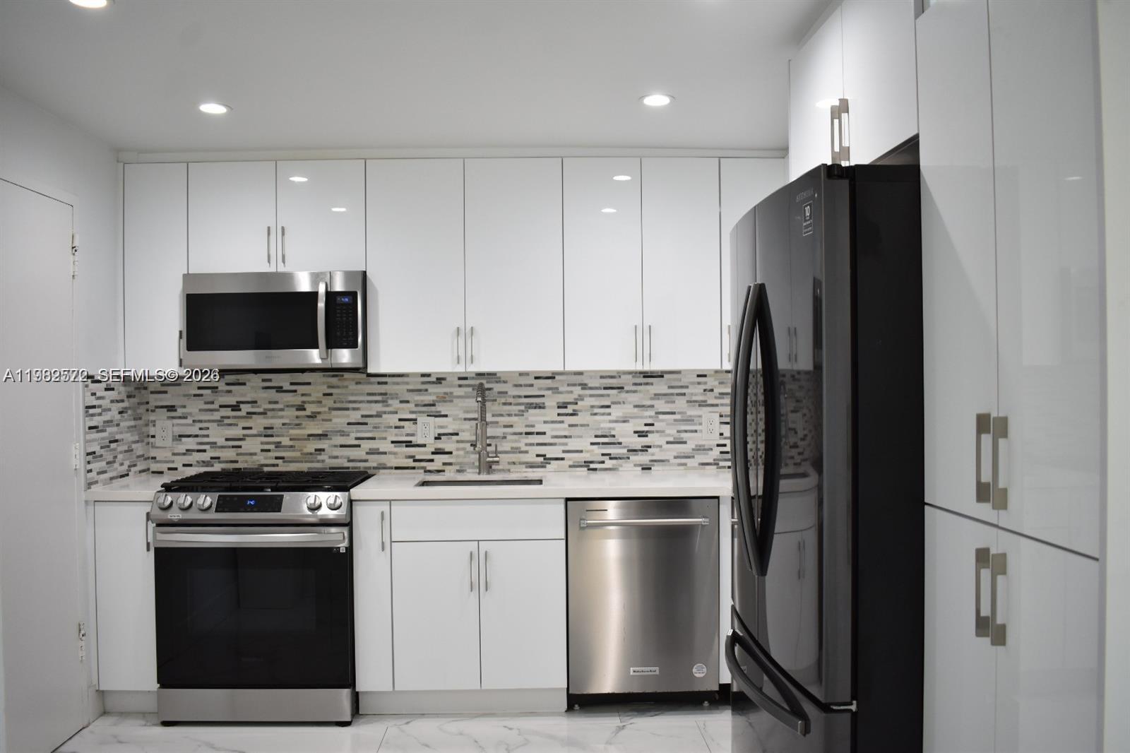 I am pleased to present this excellent opportunity to live on the water in Miami Beach. This spacious 2-bedroom, 2-bathroom corner unit features a split floor plan with stunning marble flooring, an open kitchen layout, and updated bathrooms. The unit offers plenty of natural light, ample closet space, and two private balconies with views of the Tatum Waterways canal and Tatum Park. Located in a well-maintained boutique building that recently passed its 40-year inspection, the property includes one assigned parking space, a community dock, and a large waterfront deck perfect for relaxing or fishing. The building is just three blocks from the beach and minutes away from Surfside and Bal Harbour. You will be within walking distance of North Beach Park, grocery stores and more
