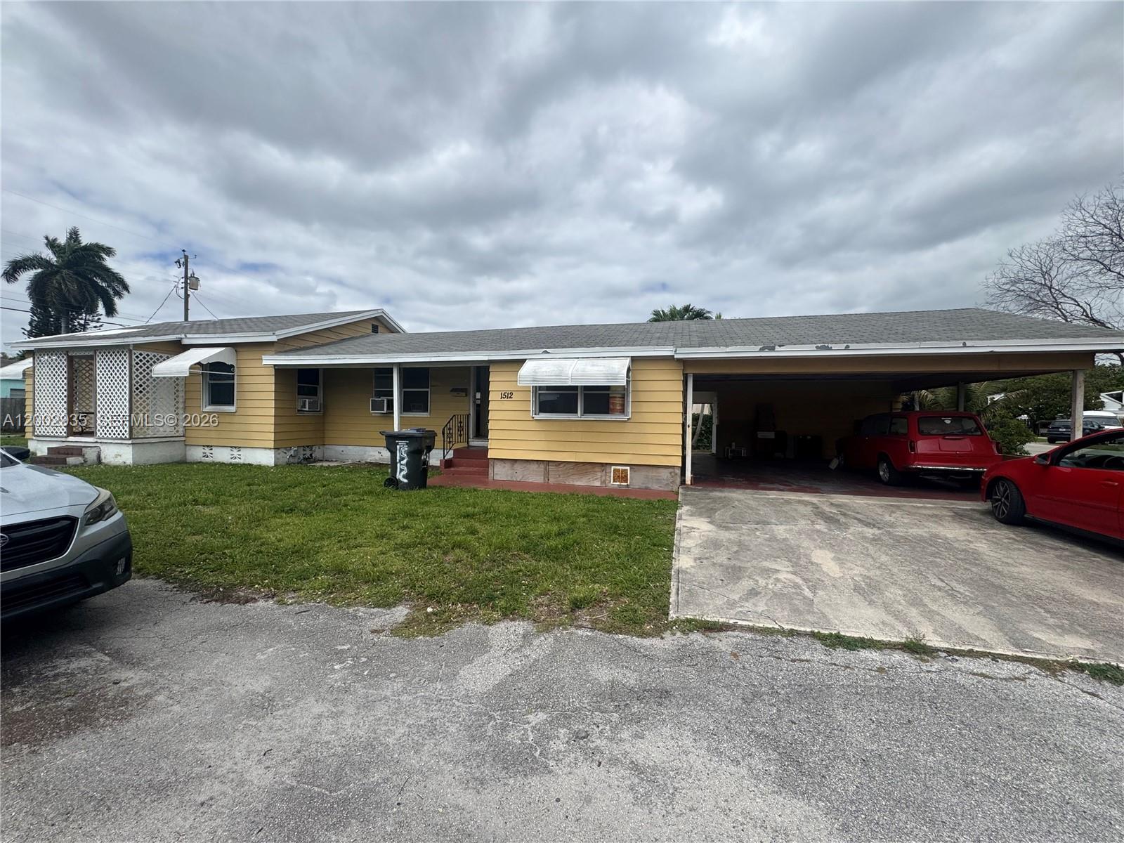 High-potential investment opportunity for a duplex situated on a prime corner lot in Hollywood, conveniently located near I-95. This property offers a versatile layout and significant upside for the right buyer.

The duplex consists of two distinct units:

- Unit 1 features two bedrooms and one bathroom, and is currently vacant.
- Unit 2 features one bedroom and one bathroom, and is currently occupied, generating $1,300 per month in rental income.

The property is equipped with practical features including a four-car carport, individual laundry rooms for each unit, and separate meters for both water and electricity. As a fixer-upper, this is an ideal choice for investors looking to add value or for an owner-occupant seeking a primary residence with supplemental rental income.
