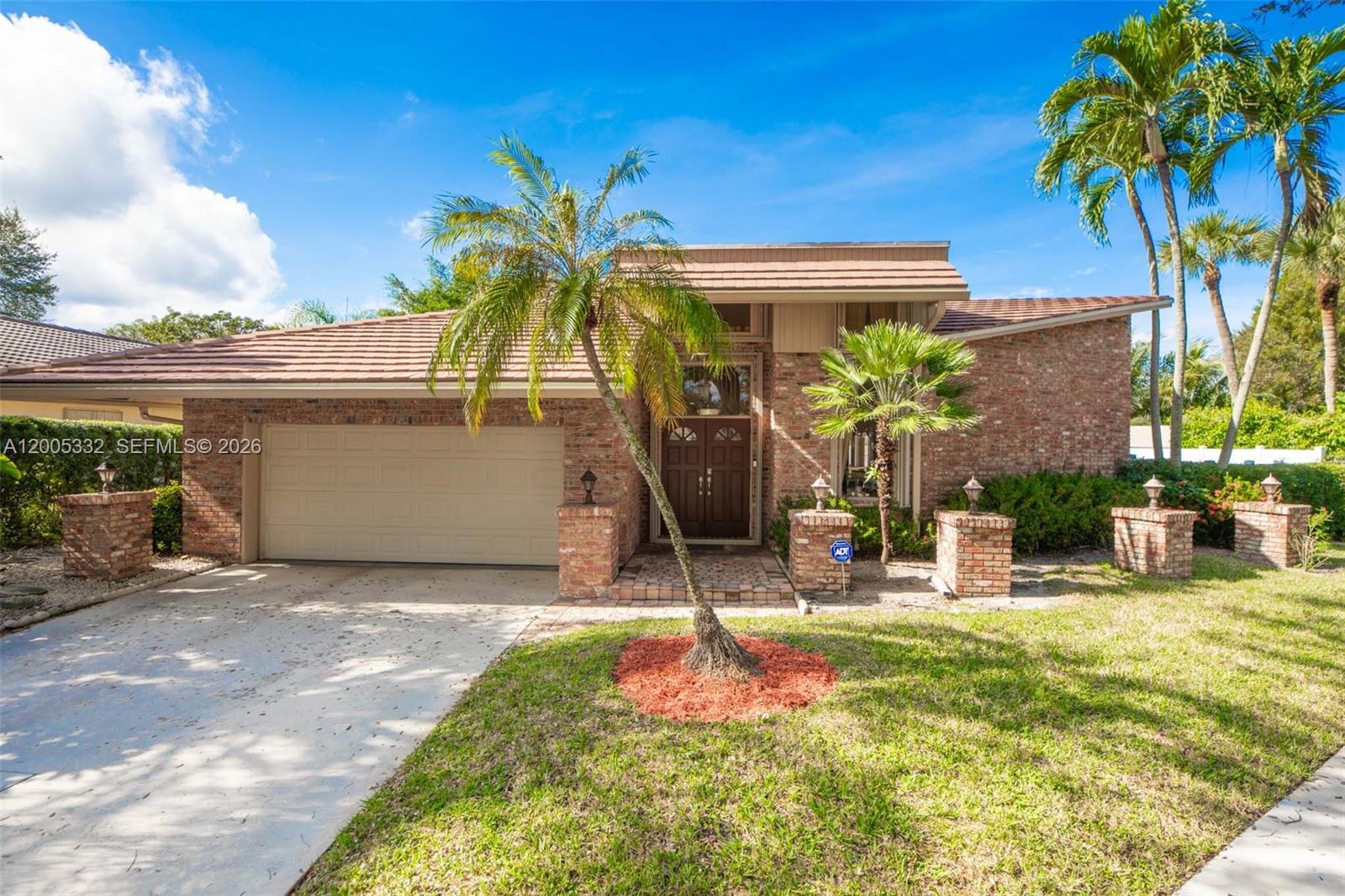 RARELY AVAILABLE IN WHISPERING WOODS! Experience elevated South Florida living in this stunning golf course home in the heart of Boca Raton. With 3,207 square feet, 4 bedrooms, and 3.5 baths, this residence blends spacious design with refined upgrades; soaring 20-foot vaulted ceilings create a dramatic first impression in the living and dining rooms, while walls of glass invite natural light throughout; the expansive 700 sq. ft. primary suite offers serene golf course views — your own private escape at the end of the day; step outside to a beautifully updated pool featuring Diamond Brite resurfacing and new tile (2021), perfect for entertaining or relaxing in total privacy, enhanced by a new hurricane-rated fence (2019); additional highlights include: complete hurricane protection, solid wood cabinetry in kitchen and baths, new roof (2018), exquisite gated community with low HOA, 5 minute drive to Town Center Mall and Sugar Sand Park, easy access to I-95, walking distance to houses of worship; a rare opportunity to own a golf course property with major upgrades already completed; the golf course, Via Mizner, has been completely re-done over the past few years; Whispering Woods is a part of the Great Boca Raton Beach & Parks District offering their residents access to the Boca Raton beaches etc.