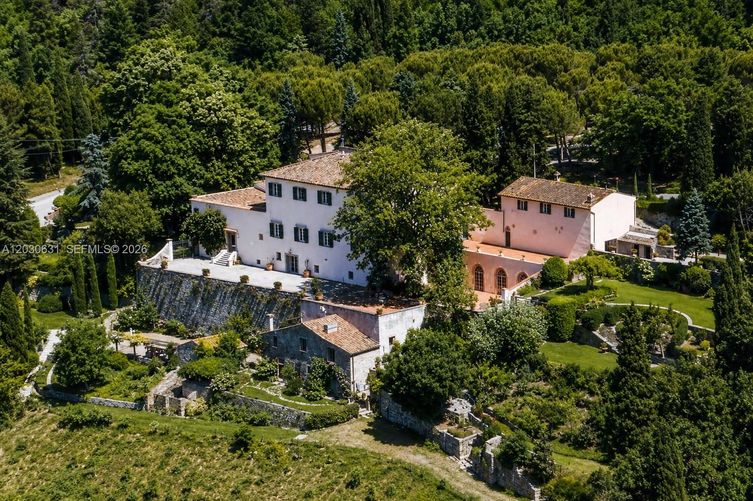 Massimiliano Mlekus Cocchi  Realtor at Keller Williams Miami Beach proudly present this Historic 13th-century estate in one of Fiesole’s most prestigious panoramic locations, offering breathtaking views of Florence and the surrounding hills. Centered around a medieval tower house later expanded during the Renaissance, the property includes a main villa of approx. 1,465 sq.m. with elegant historic interiors, vaulted ceilings, original stone details, decorative cornices, columns, cloister, and nymphaeum. Additional spaces include approx. 350 sq.m. of cellar, storage, and utility areas, plus an independent farmhouse of approx. 235 sq.m. with private entrance, terracotta floors, pietra serena details, and an original historic oven, ideal for guests, staff, or family use. The estate extends over approx. 257,394 sq.m. / 63.6 acres of olive groves, woodland, formal gardens, and panoramic terraces, ensuring exceptional privacy just minutes from Florence. Unique features include a Buontalenti-style grotto with central sculpture and a stone amphitheater, creating an extraordinary setting for luxury events, destination weddings, private retreats, or cultural gatherings. A rare opportunity for a prestigious private residence, boutique hospitality project, or world-class event venue in one of Tuscany’s most iconic settings.