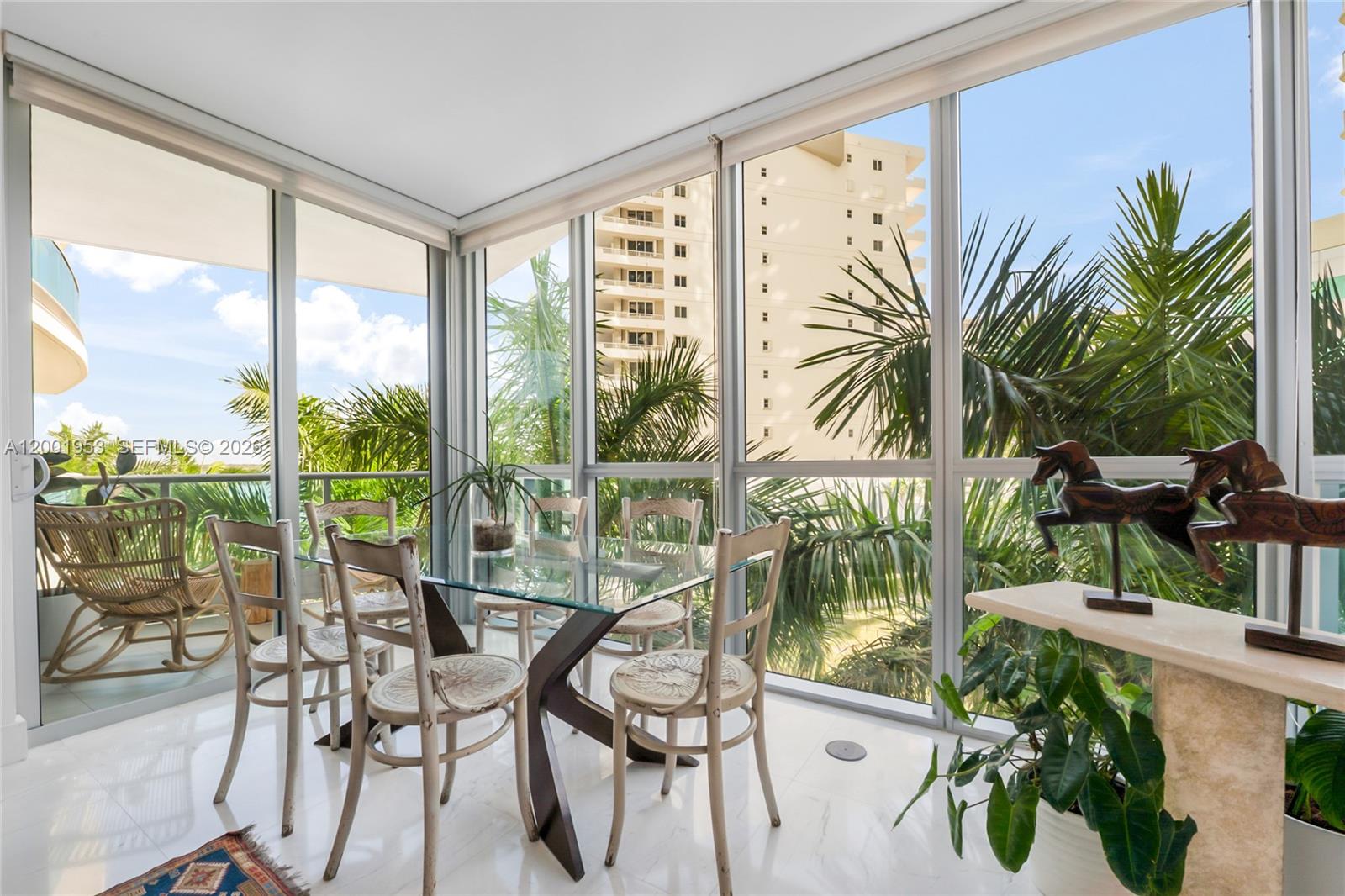 Jade Residences at Brickell Bay charming corner surrounded by lush palms, with a peek of Biscayne Bay beyond. Conveniently located on the 4th floor with same floor access to parking space & storage. Floor-to-ceiling windows and two expansive terraces create seamless indoor-outdoor flow, filling the home with natural light and a rare backyard ambiance in the heart of the city. The spacious split 2-bedroom, 2-bath layout features an open kitchen with Miele and Sub-Zero appliances, sleek maple cabinetry, and granite countertops. Enjoy full-service luxury living with 24-hour concierge, resort-style bayfront infinity pool, state-of-the-art fitness center, spa, sauna, assigned parking plus valet for a second car and guests — all just steps from Brickell's premier dining, shopping, and entertainment.