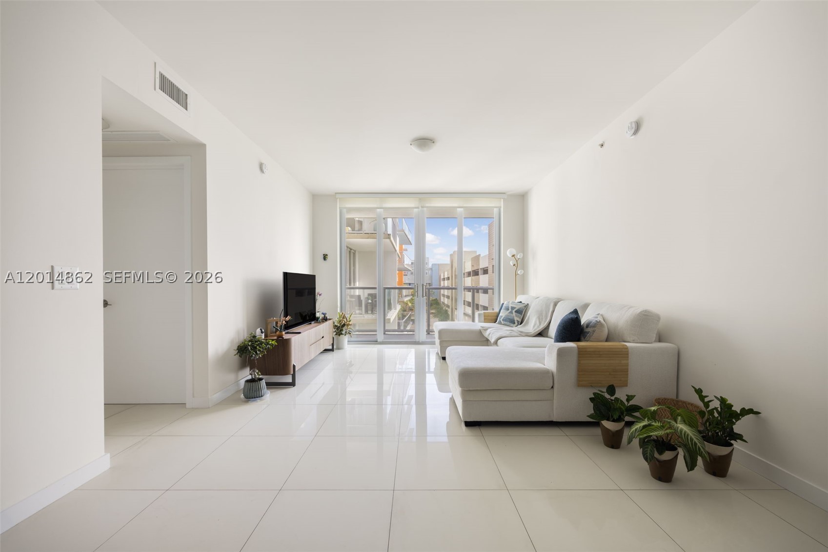 Beautiful 2-bedroom, 2-bath residence located on the 4th floor in the highly desirable Midtown Doral community. Featuring 1,130 SqFt of living space with elegant oversized porcelain floors throughout, this unit offers a modern and sophisticated design in one of Doral’s most convenient locations. Includes two covered parking spaces.
Perfect for families thanks to its proximity to top-rated A+ schools, while also representing an excellent investment opportunity with strong rental demand. Residents enjoy access to the exclusive Century Midtown Club Spa & Fitness Center, included with the community amenities, featuring a fully equipped fitness center, resort-style pool, spa, lounge areas, and recreational spaces.
Additionally, all four residential towers offer commercial spaces on the ground level, creating a true walkable lifestyle with restaurants, cafés, bakery, mini market, fitness studios, pilates, dental office, hair salon, ice cream shop, and many other convenient services just steps away.
The association is exceptionally organized and maintains the building in pristine condition, with personalized lobby/front desk attention 7 days a week. 
Conveniently located near Publix, CVS, and with immediate access to the Turnpike for quick connectivity throughout Miami. Ideal for both end-users and investors seeking location, lifestyle, and convenience.