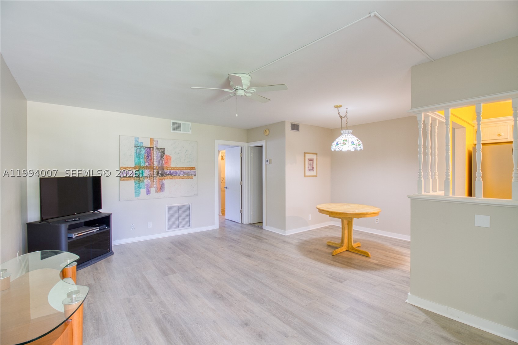 Freshly updated first-floor condo in the vibrant 55+ community of Hampton Gardens. Brand new luxury vinyl plank flooring installed throughout entire home. Enjoy your morning coffee or an evening cocktail on the screened-in front porch overlooking the lovely community courtyard. The interior offers a spacious layout, featuring a large primary bedroom with a walk-in closet and en-suite bath. Unit includes separate storage bin. The community offers excellent amenities, including a pool, shuffleboard, clubhouse, and a variety of social activities. Ideally located just 1.5 miles from the beach, this is a truly friendly and welcoming place to call home.