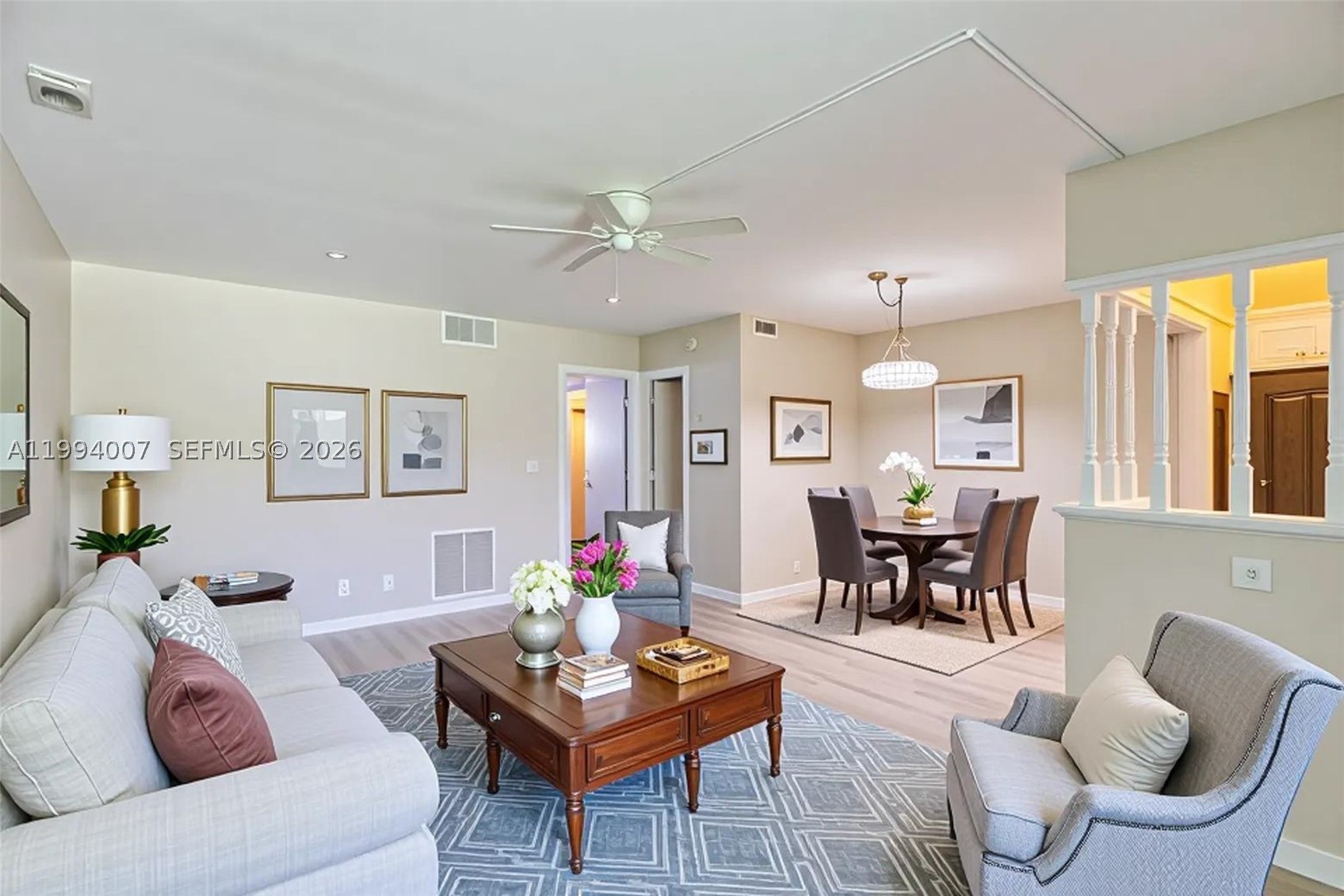 Freshly updated first-floor condo in the vibrant 55+ community of Hampton Gardens. Brand new luxury vinyl plank flooring installed throughout entire home. Enjoy your morning coffee or an evening cocktail on the screened-in front porch overlooking the lovely community courtyard. The interior offers a spacious layout, featuring a large primary bedroom with a walk-in closet and en-suite bath. Unit includes separate storage bin. The community offers excellent amenities, including a pool, shuffleboard, clubhouse, and a variety of social activities. Ideally located just 1.5 miles from the beach, this is a truly friendly and welcoming place to call home. Best price in the community!