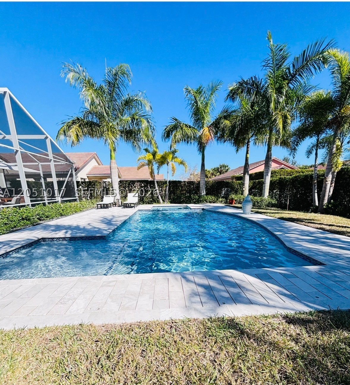 WELCOME TO THIS RARELY AVAILABLE LITTLE OASIS IN TRADITION. THIS METICULOUS 3 BEDROOM 2 BATH HAS A UNIQUE CUSTOM UPGRADES FROM INSIDE-OUT, FROM BUILT-IN CUSTOM CLOSETS, CABINETS AND DRAWS IN GARAGE, BEDROOMS, KITCHEN, LIVING ROOM AND OUTDOOR KITCHEN-BBQ. THE OUTDOOR KITCHEN-BBQ AREA IS CONVENIENTLY UNDER ROOF AND SCREENED PORCH WITH EXTRA SPACE FOR RELAXING AND ENTERTAINMENT. ENJOY THIS OWN GATEWAY WITH THE BREATHTAKING SALT HEATED POOL AND JACUZZI-SPA SURROUNDED WITH A REMARKABLE GARDEN OF PALM TREES, IN A FENCED BACKYARD.