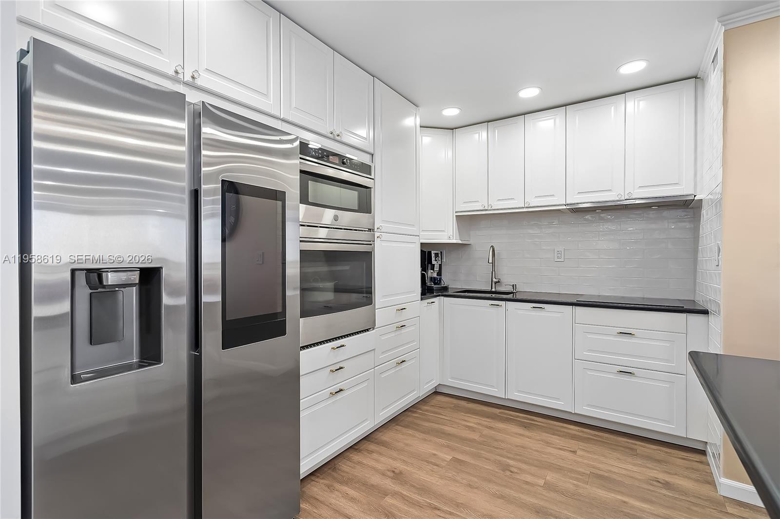 A fully reimagined 2-bedroom, 2-bath and a den residence with permitted work and an open-floor-plan kitchen, offering approximately 1,500 sq ft of beautifully designed living space. This home was renovated for personal enjoyment, not resale, and it shows in every thoughtful finish and upgrade. The open kitchen anchors the living space and was redesigned to maximize flow, light, and functionality. It features granite countertops, a Samsung smart refrigerator with integrated display, Samsung cooktop, Bosch dishwasher, GE oven/microwave combo, and a sleek Miele hood, all selected for performance, reliability, and modern aesthetics. The expanded living area, completed with fully permitted work, blends seamlessly into the open layout, creating a spacious, comfortable environment ideal for entertaining or everyday living. Built-in KEF speakers paired with a Sony receiver deliver rich, immersive sound throughout the main living space.
Bathrooms evoke a refined, spa-like atmosphere with automatic Woodbridge toilets and quality finishes that elevate daily living. Every improvement was thoughtfully executed, with attention to both form and function.
Located at 600 Three Islands Blvd, Unit 604, Hallandale Beach, this residence represents a rare combination of permitted upgrades, open design, premium materials, and genuine pride of ownership. An exceptional home to enjoy, where no detail was spared.
