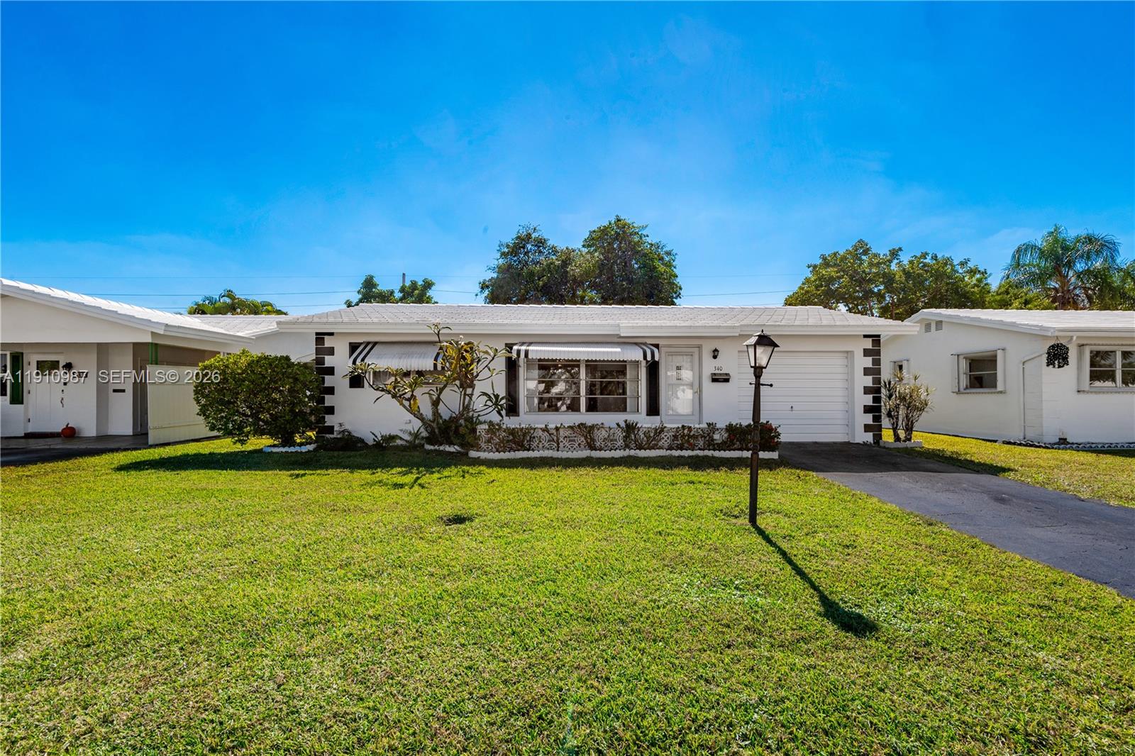Fabulous Affordable South Florida Home in a lovely quiet 55+ Community. Brand new 2025 roof, a $25,000 value with warranty to transfer. Kitchen has been opened up to the living area and has brand new stainless appliances. Walking distance to the pool, and not backing up to the I95, on a quiet street makes this very desirable. Community has 2 pools, a par 3 golf course, shuffleboard, 2 club houses and an exercise room. Management is on site. Low HOA fee $310 m includes water, lawn care, sprinklers and outside house painting. There is also a small monthly Land lease fee $106.12  Close to beach, restaurants, shopping and I95.