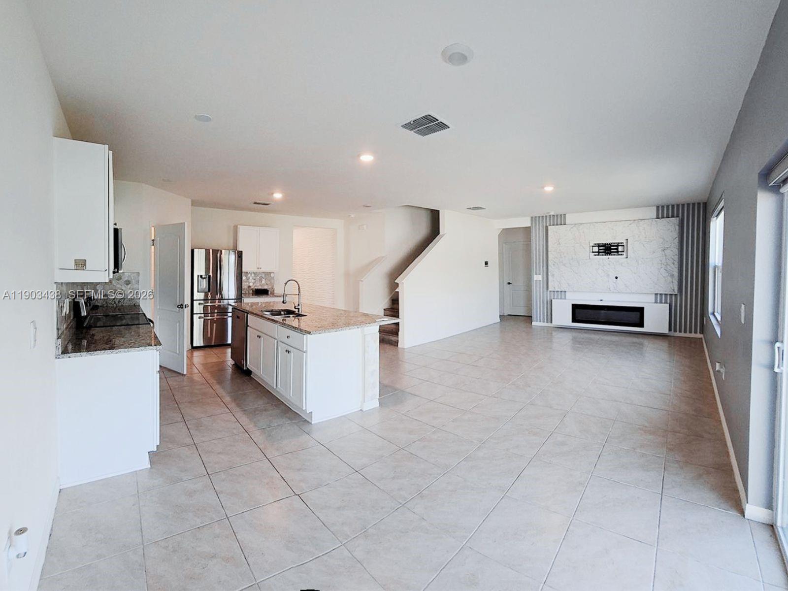 WHY BUY BUILDER GRADE WHEN YOU CAN HAVE IT ALL ALREADY INCLUDED? This exceptional Hayden model stands out from the rest with premium upgrades already completed throughout the home. Featuring 5 bedrooms, 3 full baths, upgraded flooring, custom closets, motorized blinds, designer accents, fireplace, Smart Home technology, and over 2,600 sq. ft. of beautifully designed living space. Enjoy the convenience of a first-floor bedroom and full bath, a spacious loft, and a modern gourmet kitchen with quartz countertops and stainless steel appliances. Move-in ready, better than new, and ideally located near Disney, Champions Gate, shopping, restaurants, and major highways. Experience the difference of a home where the upgrades are already done for you.