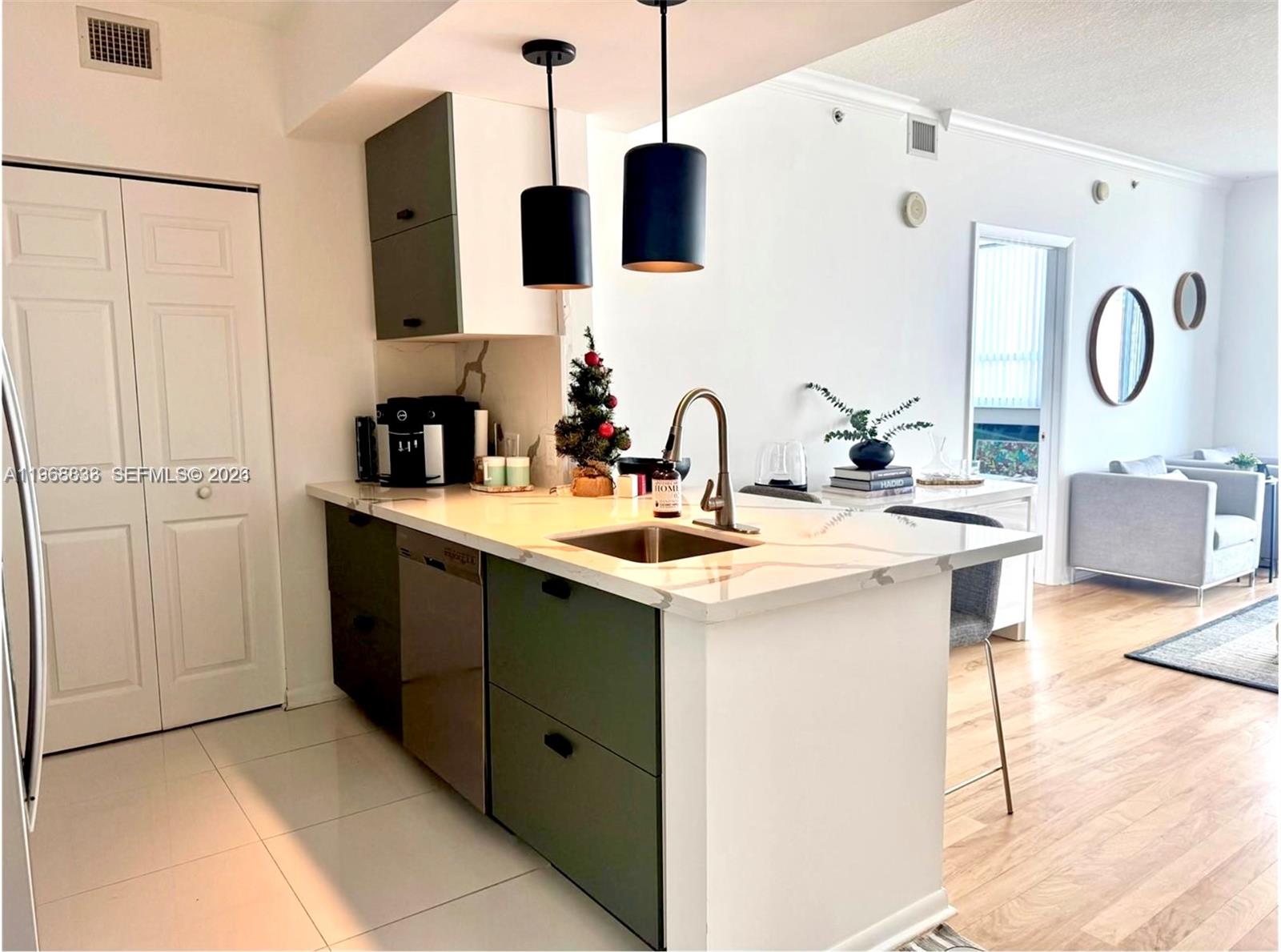 Beautifully updated 2 bedroom, 2 bath residence at Cité on the Bay, in the heart of walkable Edgewater. This unit offers a bright open layout with a split floorpan and views of Biscayne Bay and the Miami skyline from a private balcony. The remodeled kitchen features quartz countertops and stainless steel appliances. The updated unit is complemented by a brand-new AC and real hardwood floors throughout, plus in-unit washer/dryer. The spacious primary suite includes a walk-in closet and an ensuite bath with double vanity. Full-service luxury amenities include covered parking, a heated pool with sun deck and jacuzzi, fitness center, yoga studio, club room, workspaces, 24-hour concierge, valet, and security. Ideally located across from Margaret Pace Park and minutes to Wynwood, Midtown, and the Design District. The unit is currently rented through February 2027 at $3,800/month. This is an exceptional turnkey investment opportunity in an extremely well financially managed and maintained building. Units can be rented 12 times per year, minimum 30 day lease which also makes it a fantastic long term investment opportunity.