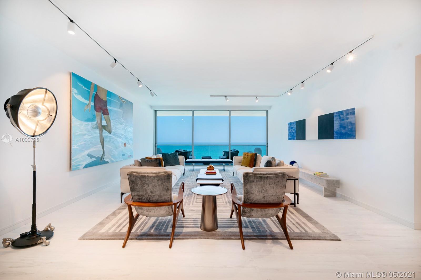 Made for a Design Aficianado! Let good taste reign. The direct Oceanfront residence features 2 Bedrooms + Den/ 3.5 Baths, an expansive 445 SF terrace to experience sunrise, ocean & sky views. This sleek beach pad sports beautiful honed pantelikon marble, tan oak floors in the bedrooms, & custom millwork throughout. The concept of open living/dining/kitchen is embraced and is ideal for hosting. The chef’s kitchen features a stand-out calacatta marble center island, & top of the line Gaggenau appliances including a full-size wine fridge. The primary suite boasts a large walk-in closet finished by Italian firm Illimiti, direct terrace access & a stunning bath finished in marble & Ipe wood featuring a rain shower & large Boffi soaking tub. The property is to be appreciated and properly priced