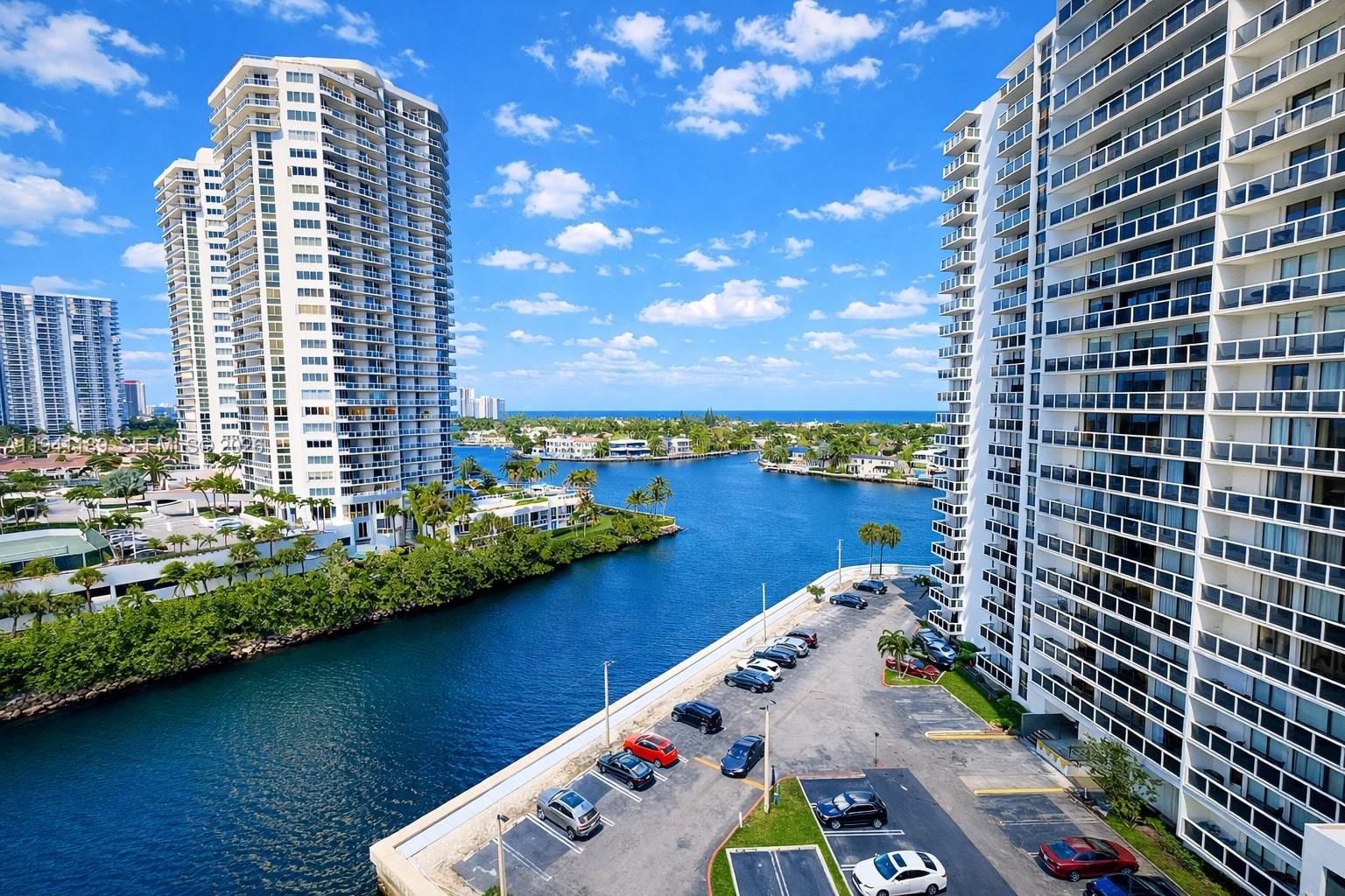 STEP INSIDE AND BE CAPTIVATED BY SWEEPING VIEWS OF THE INTRACOASTAL, GOLDEN BEACH, AND THE OCEAN WHICH ARE SHOWCASED THROUGH EXPANSIVE WINDOWS AND TWO TERRACES THAT FLOOD THE RESIDENCE WITH NATURAL LIGHT. FROM SUNRISE TO SUNSET, THE EVER-CHANGING WATER AND SKY CREATE A STUNNING BACKDROP THAT ELEVATES EVERYDAY LIVING. THIS APARTMENT OFFERS A GENEROUSLY SCALED, THOUGHTFULLY DESIGNED LAYOUT WITH WIDE LIVING AND DINING AREAS IDEAL FOR BOTH RELAXING AND ENTERTAINING. THE RESIDENCE IS LARGELY ORIGINAL WITH SELECT UPDATES, PRESENTING A RARE OPPORTUNITY TO ENJOY NOW OR RENOVATE AND/OR CUSTOMIZE WHILE PRESERVING THE EXCEPTIONAL VIEW THAT DEFINES THE SPACE. BRIGHT, OPEN INTERIORS ENHANCE THE SENSE OF AIRINESS AND FLOW THROUGHOUT THE UNIT. BEDROOMS ARE COMFORTABLY SIZED, STORAGE IS AMPLE, AND THE CLASSIC FLOOR PLAN PROVIDES FLEXIBILITY AND LONG-TERM VALUE RARELY FOUND AT THIS PRICE POINT. PERFECTLY SITUATED NEAR BEACHES, MARINAS, WATERFRONT DINING, SHOPPING, AND ENTERTAINMENT, THIS LOCATION BLENDS COASTAL TRANQUILITY WITH EVERYDAY CONVENIENCE. WHETHER AS A PRIMARY RESIDENCE OR SEASONAL RETREAT THIS HOME DELIVERS REMARKABLE LIGHT, SPACE, AND VIEW!  A UNIQUE OPPORTUNITY TO OWN A RESIDENCE WHERE A COUNTRY CLUB LIFESTYLE PLUS BREATHTAKING WATER VIEWS AND POTENTIAL COME TOGETHER—BRING YOUR VISION AND CREATE SOMETHING TRULY SPECIAL.