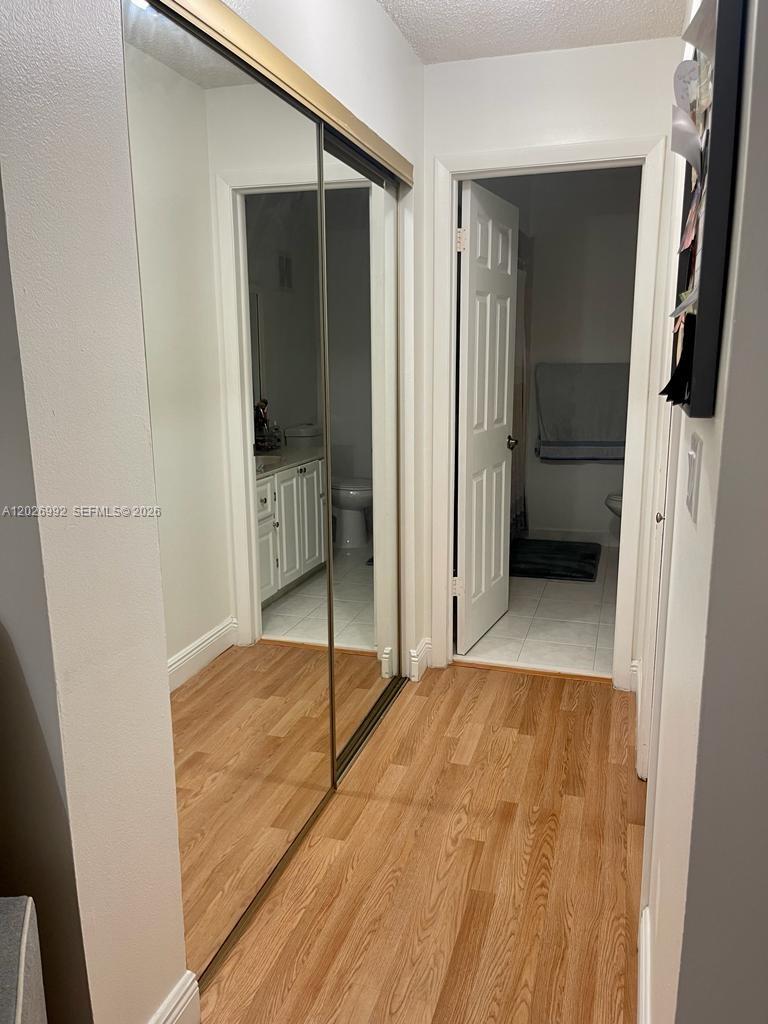 BUILDING FOUR OF RACQUET - Residential Lease