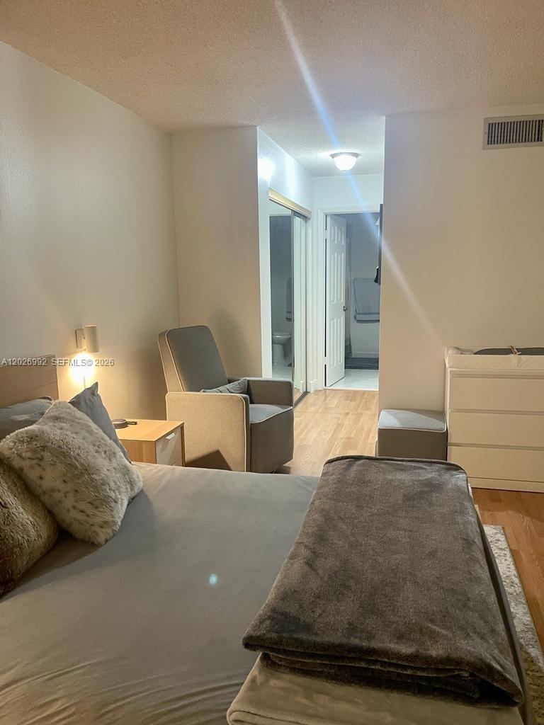 BUILDING FOUR OF RACQUET - Residential Lease