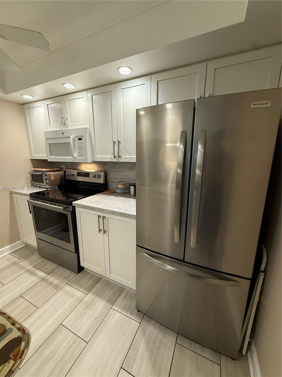 TURN-KEY FURNISHED 2 bed/2 bath condo located on the first floor with its own patio area. This condo is located in the gated community of Waterside Village which is an all age HOA. Quality vinyl throughout the unit and washer/dryer are inside the unit. Gorgeous renovated kitchen with white cabinets and updated countertops. Mostly stainless steel appliances and equipped with a dishwasher. Hurricane impact windows located in the bedrooms. Community offers many amenities such as security, gate, pools, library, etc!  Additional locker space located outside that is shared with one neighbor.