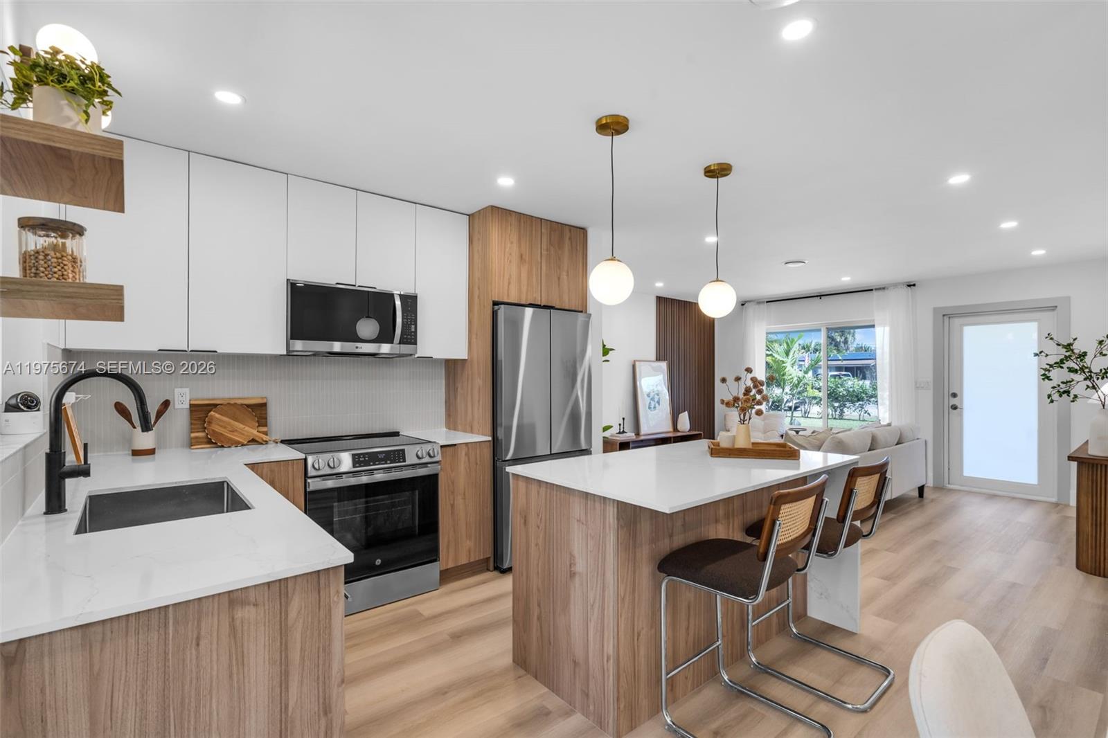 An exceptional opportunity, fully updated with impact windows, a new roof, and a sleek chef’s kitchen ready for immediate enjoyment. Spacious, bright interiors feature custom closets and beautifully updated baths. The private fenced yard with pergola is perfect for entertaining and enjoying South Florida living. Offered partially furnished with select pieces included, providing added value and convenience. Ideally located near Wilton Drive and just minutes from the beach, this move-in-ready home delivers style, comfort, and location at an exceptional value. Motivated seller! Seller willing to contribute toward buyer closing costs with an acceptable offer.