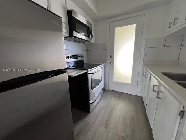 Beautifully renovated third-floor unit in a charming and quiet community! This 1-bedroom, 1-bathroom apartment offers a spacious layout with newer vinyl flooring. The sleek kitchen features stainless steel appliances, quartz countertops, a double steel sink, and plenty of cabinet space. Extra features include large spacious closets and assigned parking. Enjoy the convenience of an additional large storage closet, access to a community laundry room, and a recreation area. Located just east of I-95, this prime location is less than half a mile from US-1 and Lighthouse Point, offering easy access to shopping, dining, and entertainment.