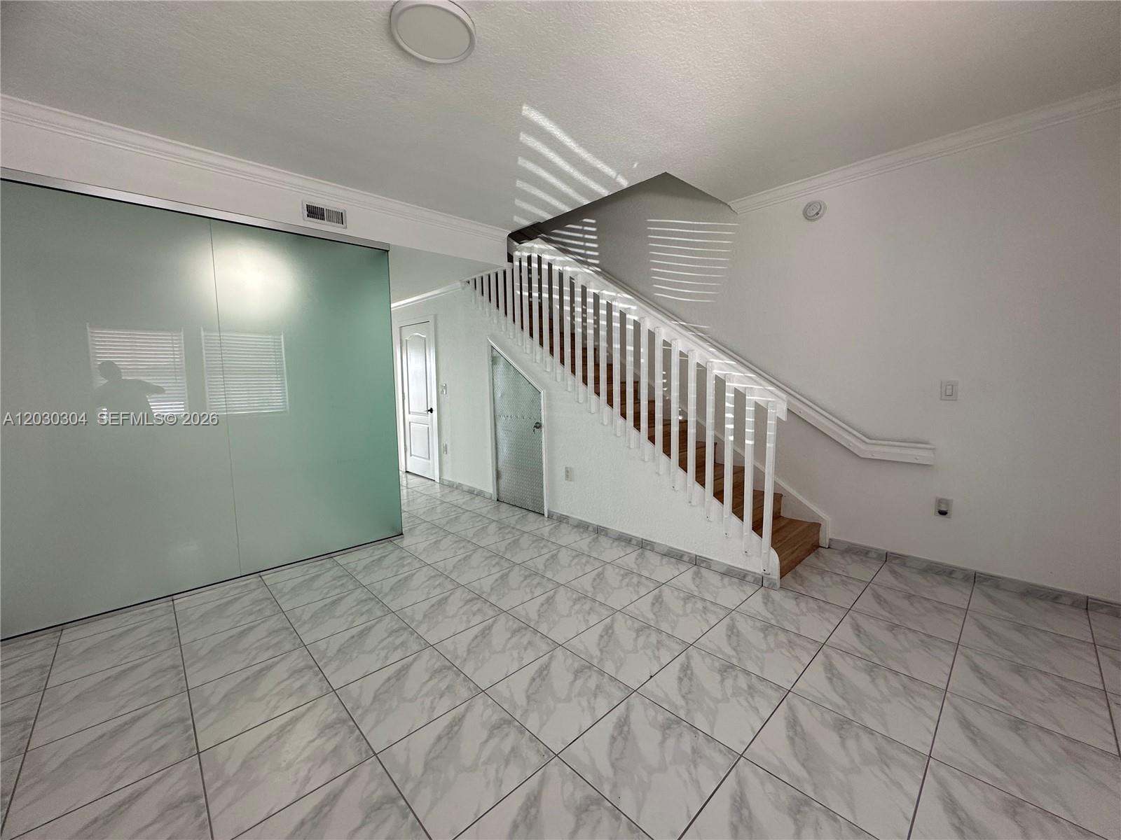Spectacular 2 Bedrooms + Den 3 full bath townhome with lake view in the community of Hialean Gardens, and oversized covered backyard with a dock perfect for entertaining, Spacious well maintained design. Stainless steel appliances, large washer and dryer in the include, hurricane protection on all windows includes high impact windows in the living room, two conveniently located assigned parking spaces in front of the unit and laminated on stairs to facilitate maintenance. Amazing location, easy access to major highways, great schools, restaurants and shopping centers.
