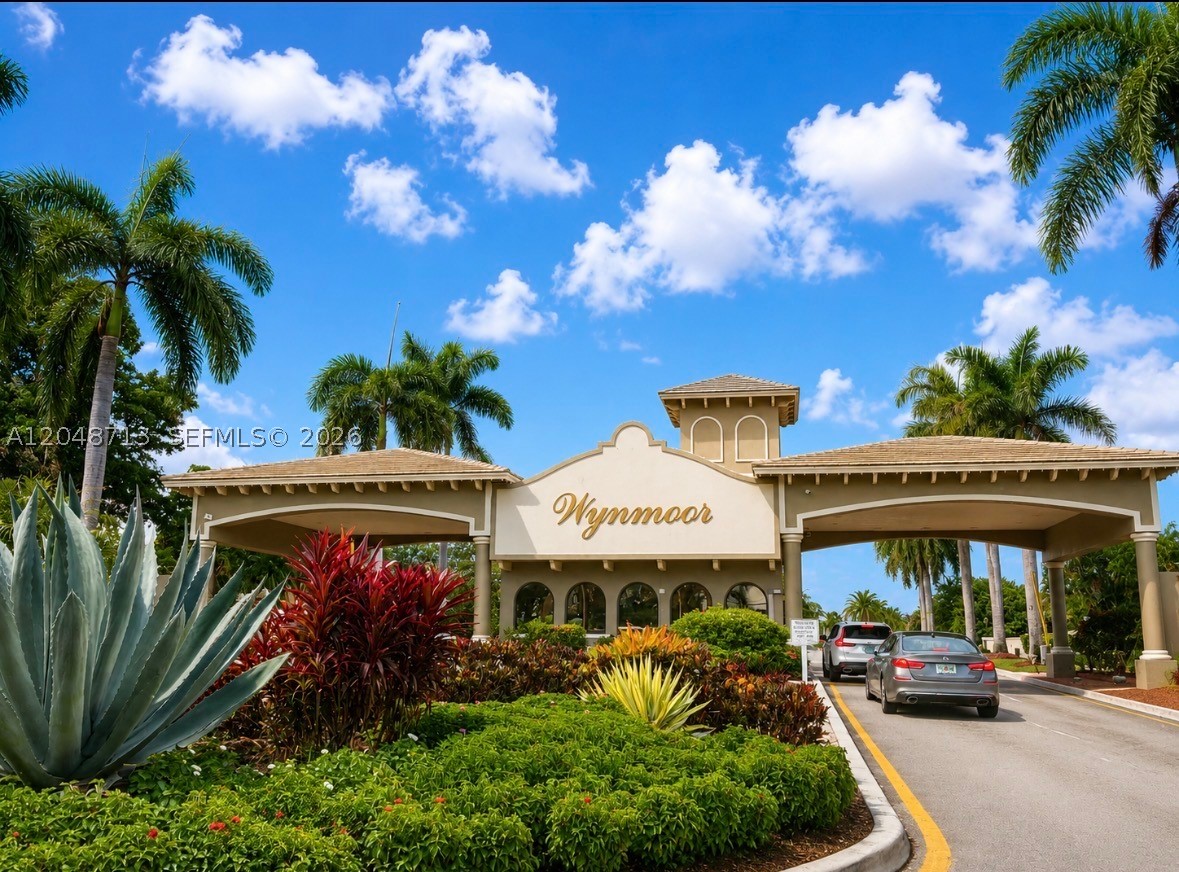 Experience award-winning 55+ resort-style living in this beautifully updated first-floor garden-style condominium in Bimini Village, one of the most sought-after villages within prestigious Wynmoor Country Club. This spacious 2-bedroom, 2-bath residence offers the perfect blend of comfort, convenience, and active Florida living in the heart of Coconut Creek. Features include stainless steel appliances, updated wood-look laminate flooring, impact windows and sliding glass door, spacious living and dining areas, walk-in closets, and a glass-enclosed patio overlooking the golf course. Assigned parking is conveniently located just outside your front door. Enjoy an impressive collection of amenities including an 18-hole executive golf course, resort-style pools, tennis, pickleball, fitness center, walking trails, theater, clubhouse, restaurant, café, community clinic, courtesy shuttle, Activities Director, assigned storage, EV charging stations, beautifully landscaped grounds, 24-hour guard-gated security, and roaming patrol. Monthly maintenance includes water, basic cable, exterior maintenance, landscaping, and exceptional amenities. No current special assessments, completed 40-year certification, and a one-time capital contribution of only $500—a fraction of what many South Florida country club communities require.