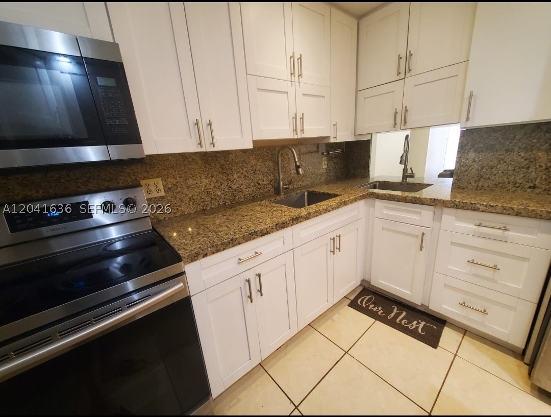 Lovely updated 2 bedroom, 2 bathroom condo in heart of North Miami Beach!  Enjoy breathtaking top-floor views of the iconic Guitar Hotel and Sunny Isles skyline.  This bright and spacious residence features two full bathrooms, abundant closet space, and custom built-ins for added convenience and storage.  Available furnished or unfurnished to suit your needs.  Ideally located near shopping, schools, and houses of worship.  Offering comfortable and convenient South Florida living.