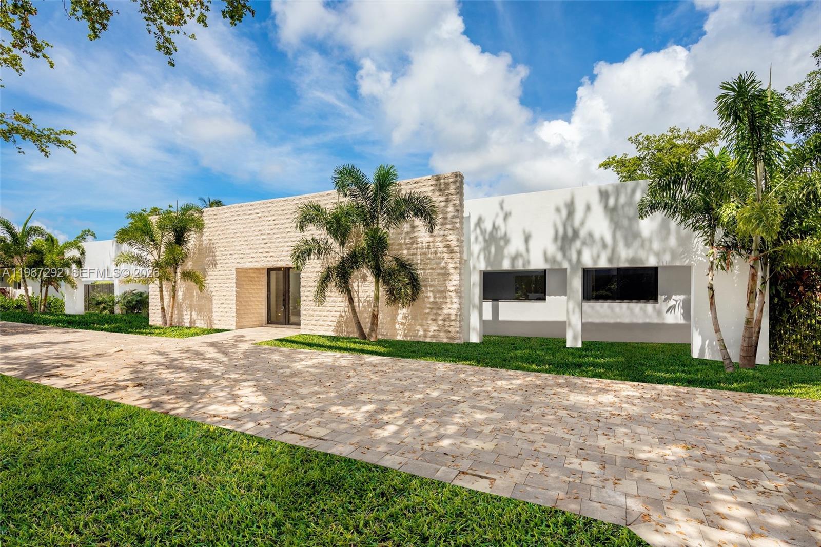 Impeccably reimagined, this residence in Pinecrest By The Sea epitomizes lavish living. Grey porcelain floors grace all 6 bedrooms adorned with custom closets, while opulent natural stones define each bathroom. The dream kitchen invites culinary delights, complemented by an outdoor kitchen perfect for entertaining in the seamless blend of indoor-outdoor spaces. A heated pool beckons for relaxation amidst open living areas, embodying elegance and comfort. Security cameras ensure peace of mind. Nestled in a serene, gated community, this haven stands near esteemed schools, lush parks, and vibrant attractions, offering a life of luxury and convenience.