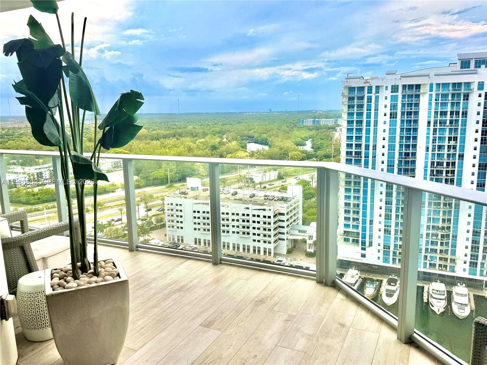 Luxurious turnkey high-floor residence on the 23rd floor at The Reserve at Marina Palms with stunning unobstructed water and city views. Spacious layout offering two master suites. Two parking spaces included. One assigned covered parking space plus complimentary valet parking for a second vehicle.  including private storage. Full-service luxury building with 24-hour concierge, gated security, spa with sauna and steam room, state-of-the-art fitness center, yoga/Pilates studio, business lounge, infinity pool with summer kitchen, kids’ pool, play area, dog trail, and elegant lobby, Private marina, full service, up to 100' boat slips. Private boat club for residents! The best location! Move-in ready.