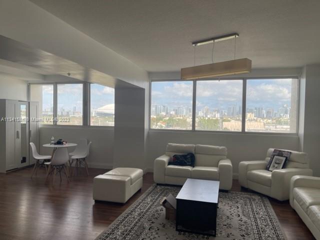 BACK ON THE MARKET! Only 1 bedroom and 1 bath unit in the building for sale now. Great open, oversize, and bright corner loft-like 1/1 unit with HUGE windows. Enclosed bedroom, wood floors
throughout, 1 parking space. A great city and Marlin Stadiums views as soon as you
walk in!! There are only 4 of these units; all other 1/1's face west. Unit will be vacant March 31st, 2023. Maintenance includes reserve funding.