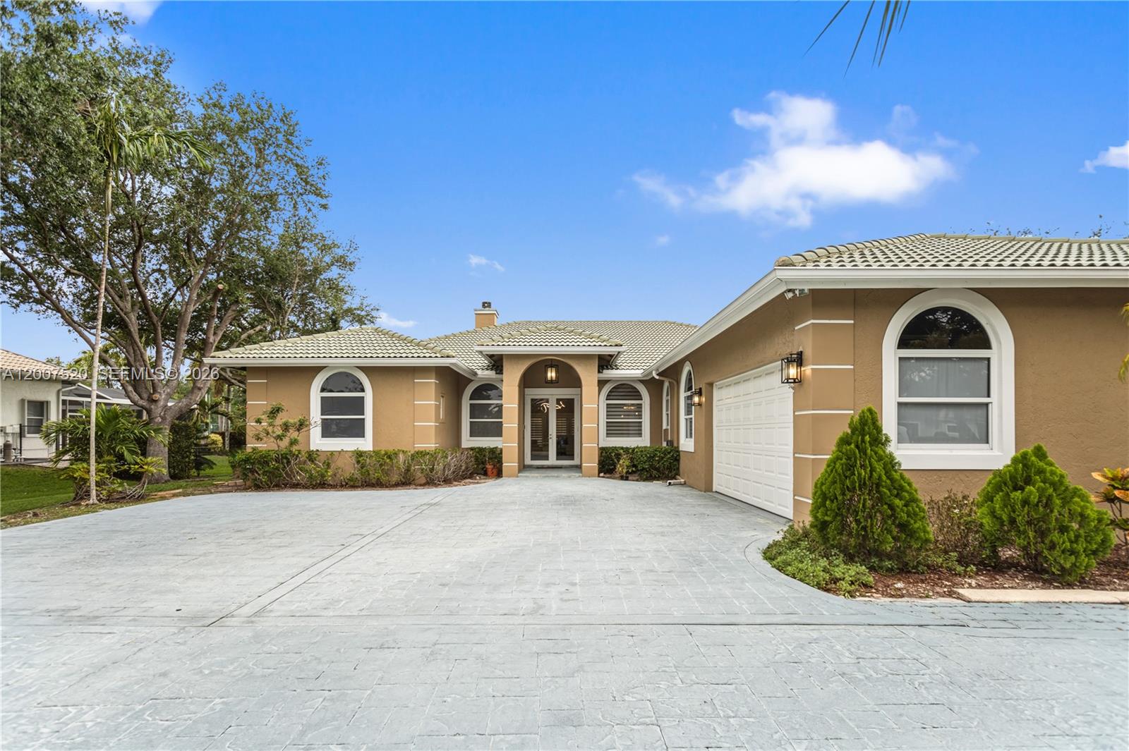 Beautifully well-maintained home sitting on nearly 1 acre with NO HOA. Main home is a 5/3 offering 4,207 sqft of living space, totaling 7BD/5BA including a fully separate 2/2 guest house with full kitchen, ideal for extended family, visiting guests, or additional rental income potential. Side-entry 3-car garage with individual doors per bay and a driveway that fits up to 14 cars. Roman-shaped screened pool with a resort-style backyard and spacious yard perfect for family parties and gatherings.