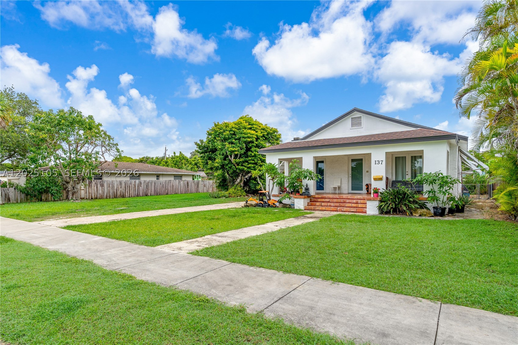 Charming Homestead Gem on a Double Lot!
Step into a home filled with character, warmth, and timeless appeal. This beautifully maintained property features a NEW ROOF, IMPACT WINDOWS, soaring ceilings, and stunning original wood floors that showcase its historic charm.
Situated on a double lot along one of Homestead’s widest streets, this property offers exceptional space, privacy, and endless potential. Inside, you'll find an inviting living area with a cozy fireplace, an updated kitchen, and a renovated bathroom, seamlessly blending classic charm with modern comforts.
Enjoy Florida living at its finest from the welcoming front porch or the expansive rear porch, perfect for relaxing, entertaining, or gathering with family and friends. With NO HOA, plenty of room for a pool, boat, RV, or future expansion, the possibilities are endless.
Whether you're looking for a charming primary residence or a unique property with room to grow, this exceptional home offers the perfect combination of historic character, modern updates, and the small-town lifestyle that makes Homestead so special. Don't miss this rare opportunity!