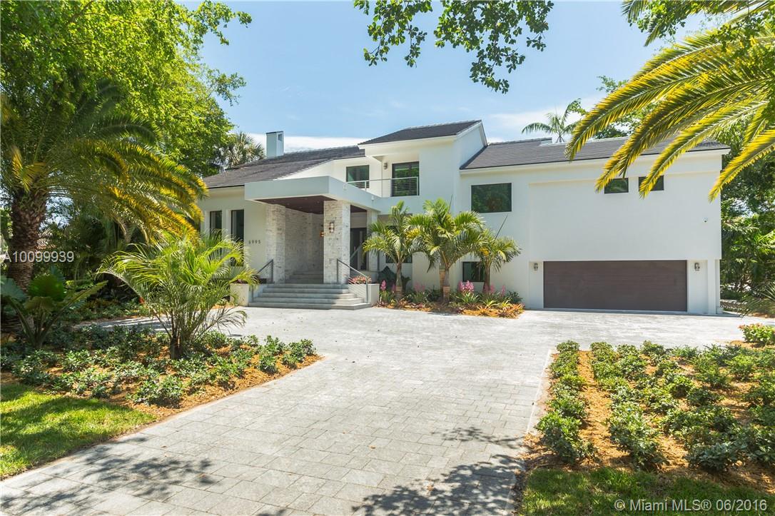 THIS HOME WAS BROUGHT DOWN TO THE CINDER BLOCK AND REBUILT IN ‘16!  IN EXCLUSIVE COCOPLUM, YOU WILL FIND THE FINEST FINISHES IN THIS 5 BED/5.5 BATH HOME ON THE WATER WITH NO BRIDGES TO THE BAY & THE OCEAN BEYOND.  THE WALNUT  KITCHEN IS STRAIGHT FROM THE SHOWS OF MILAN AND THE NATURAL STONE PATIO IS IDEAL FOR ENTERTAINING W/SUMMER KITCHEN, TV , DINING AREA  THEN  ON TO THE IPE WOOD PATH & DOCK . THIS IS TRULY TOWN AND COUNTRY LIVING WITH ONLY 20 MINUTES TO DOWNTOWN OR MIAMI INTERNATIONAL AIRPORT!