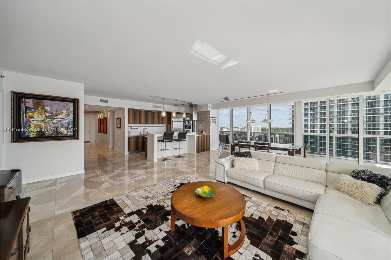 Gorgeous 3 bedrooms/3.5 baths corner unit located at Beach Club Complex. The unit is renovated with modern marble floors, European kitchen, California closets, recessed lighting, high impact glass windows leading to a spectacular " L" shape balcony overlooking a white pristine beach. Luxurious resort style building with great amenities like an oceanfront gym-spa, restaurant/bar, heated swimming pools with pool attendants, jacuzzi & spa, 24/7 concierge service, complimentary valet parking.