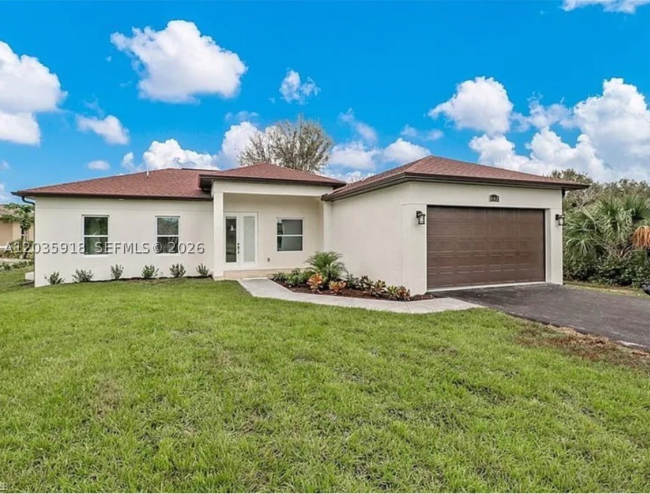 For sale, this immaculate, contemporary home in the desirable Golden Gate Estates offers modern living on a spacious 1.14-acre lot. Built in 2020 and gently lived in for just one year, the property features 3 bedrooms, a versatile den, and 2 full bathrooms, all arranged in an open-concept layout that provides both comfort and functionality. The quartz kitchen countertops, impact-resistant windows and doors, and elegant finishes throughout add a touch of sophistication. With ample outdoor space, this property offers the perfect opportunity to build a guest house, workshop, or recreational area, all without HOA restrictions. Surrounded by nature yet conveniently located near top schools and amenities, this home is ideal for those seeking privacy, flexibility, and the chance to expand their dream lifestyle in Southwest Florida
