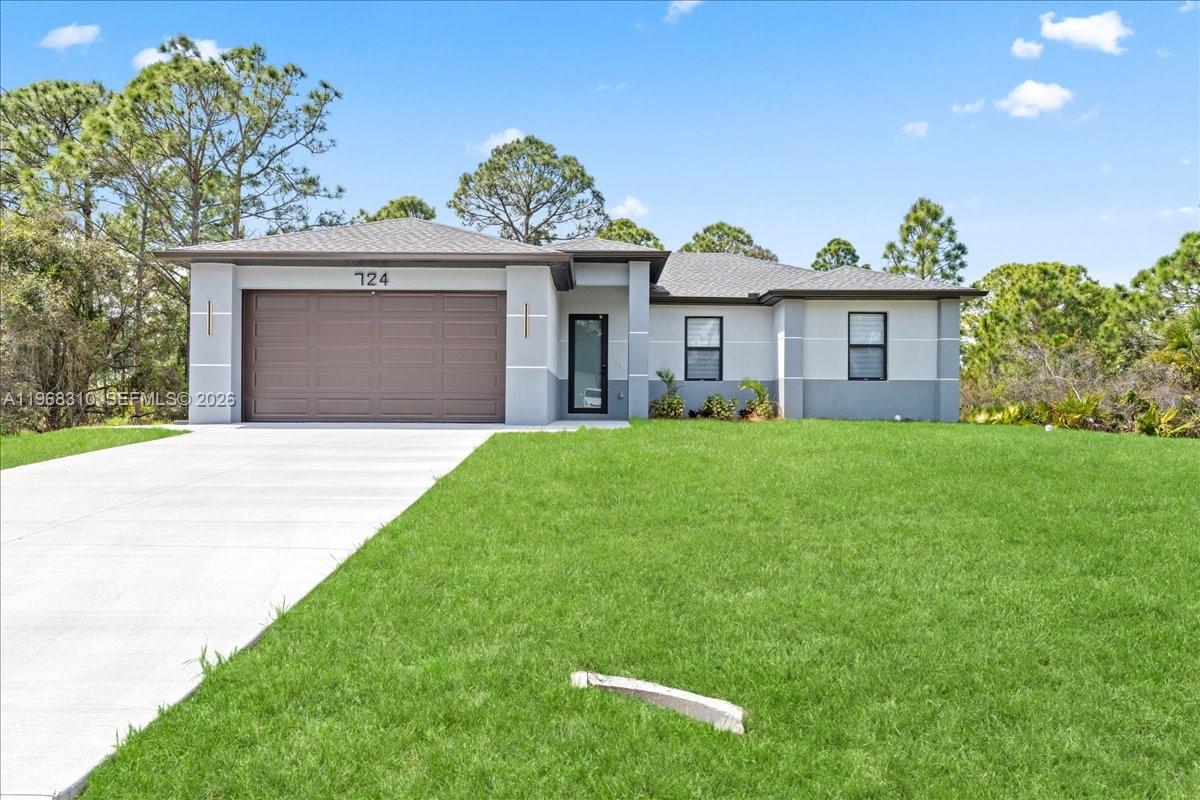 Experience the best of new construction in a flourishing area of Lehigh Acres! This stunning 3-bedroom, 2-bathroom home features a bright and airy open-concept kitchen, perfect for entertaining. The kitchen boasts elegant wood cabinets, pristine quartz countertops, and a full suite of brand-new stainless steel appliances. Enjoy the Florida sunshine and ultimate peace of mind with impact windows and doors throughout. With gorgeous porcelain tile underfoot and zero updates needed, this move-in-ready home offers the perfect blend of modern style and effortless living. Schedule your private showing today!