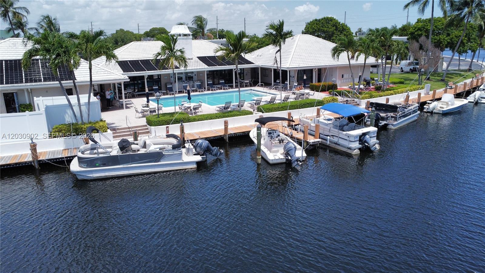 Beautifully renovated 2-bedroom, 2-bath apartment, featuring newly installed tile flooring throughout entire unit! The kitchen boasts wooden cabinetry and stainless steel appliances. Located in a boater’s paradise, this waterfront community offers optional boat dock rentals. Enjoy a modern open concept living and dining area, freshly painted and cleaned. Both bedrooms are spacious with plenty of storage throughout. Resort-style amenities include a heated pool, outdoor kitchen, library, BBQ area, sauna, gym, and pet-friendly spaces. Ample guest parking available. Just a 8-minute drive to the beach. Washer and dryer included inside the unit. Set in a quiet, family-friendly neighborhood. This community is highly sought-after by snowbirds looking for a warm and welcoming seasonal retreat