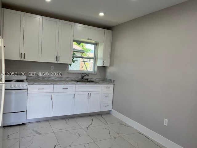 Best priced apartment completely remodeled 2-bedroom 1-bath, open kitchen, tile floors, this separate apartment affords privacy.  Rent includes water and a dedicated parking inside the property. Easy to show.