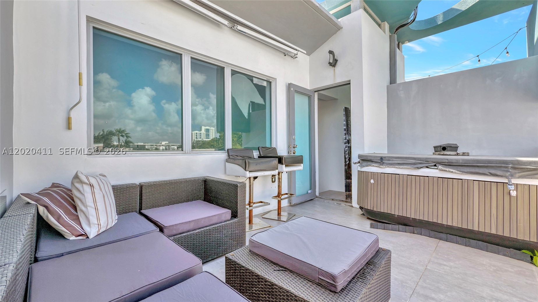 Remodeled trilevel Townhouse with 28 foot ceilings and new white porcelain plank flooring throughout. Very low Maintenance fees. Private rooftop terrace and hot tub. Quiet and secure building with only 7 units. Bright, open living space. Impact windows, 2 bedrooms?, and 2 full bathrooms. Includes 1 assigned covered parking space in a secure garage. Unbeatable location within 2 blocks of the shopping center at Alton Road and 5th Street. Walk to Flamingo Park, the beach, Lincoln Road, shops, and restaurants. Publix, Total Wine, and Whole Foods are just around the corner. This exclusive, private residence offers luxury in a prime location without the hassle of high-rise living, with very low maintenance fees.