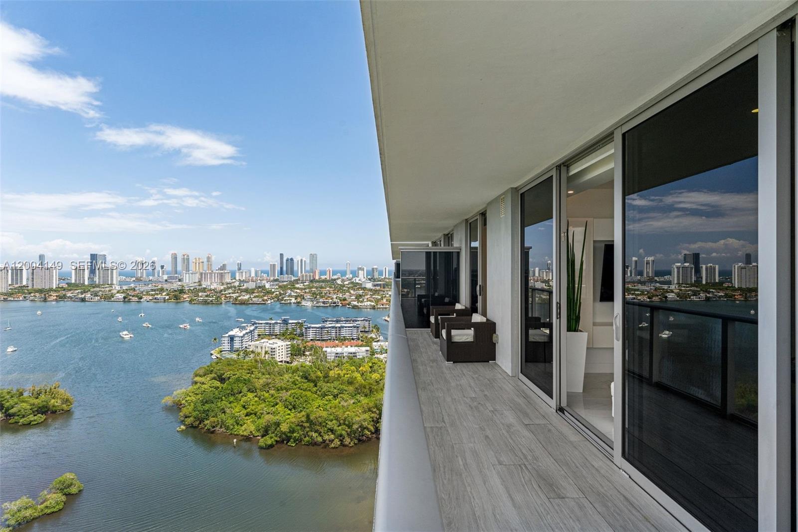 Wake up on the 30th floor to the Oleta River, the Intracoastal, and the Atlantic horizon, all from your private wraparound balcony. This rare 01-line corner residence at The Harbour North offers what few condos in South Florida can: a private elevator landing, dedicated foyer, and unobstructed water and skyline views across two full exposures permanently protected by surrounding state park. No future development. No compromised views. Ever. Inside, over $80K in designer upgrades create a turnkey luxury environment, polished marble-look tile, custom LED soffit lighting throughout, motorized shades, quartz waterfall island, and premium appliances. Every room finished with intention. 3 bedrooms, 3 baths, and a private den. Step outside and the lifestyle continues. Dock your boat or jet ski steps from your front door on the Oleta River, a waterfront privilege rare at this price point in South Florida. Resort pool, private beach, rooftop tennis, pickleball, racquetball, full fitness center, and a spa featuring sauna, steam room, hot jacuzzi, and cold plunge. Social lounge and 24-hr valet.
Minutes to Aventura Mall, Bal Harbour Shops, and the beach, yet nestled inside a protected natural preserve that feels worlds away. This is not just a residence. It is a lifestyle most only see from the water. Fully furnished and move-in ready with smart home technology, premium electronics, and a curated interior included. Private viewings available upon request.
